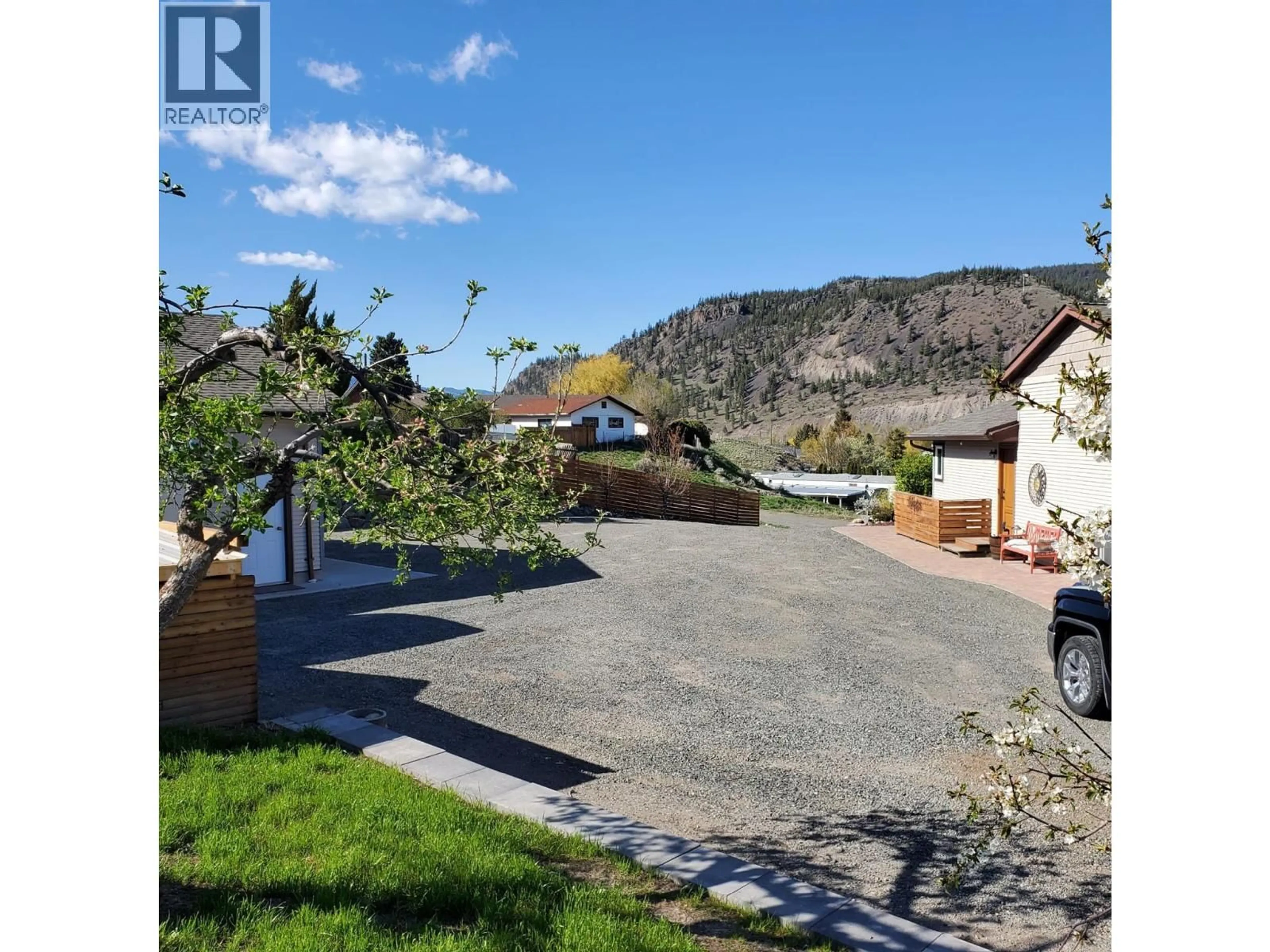 A pic from outside/outdoor area/front of a property/back of a property/a pic from drone, street for 1301 FIR AVENUE, Merritt British Columbia V1S1L1