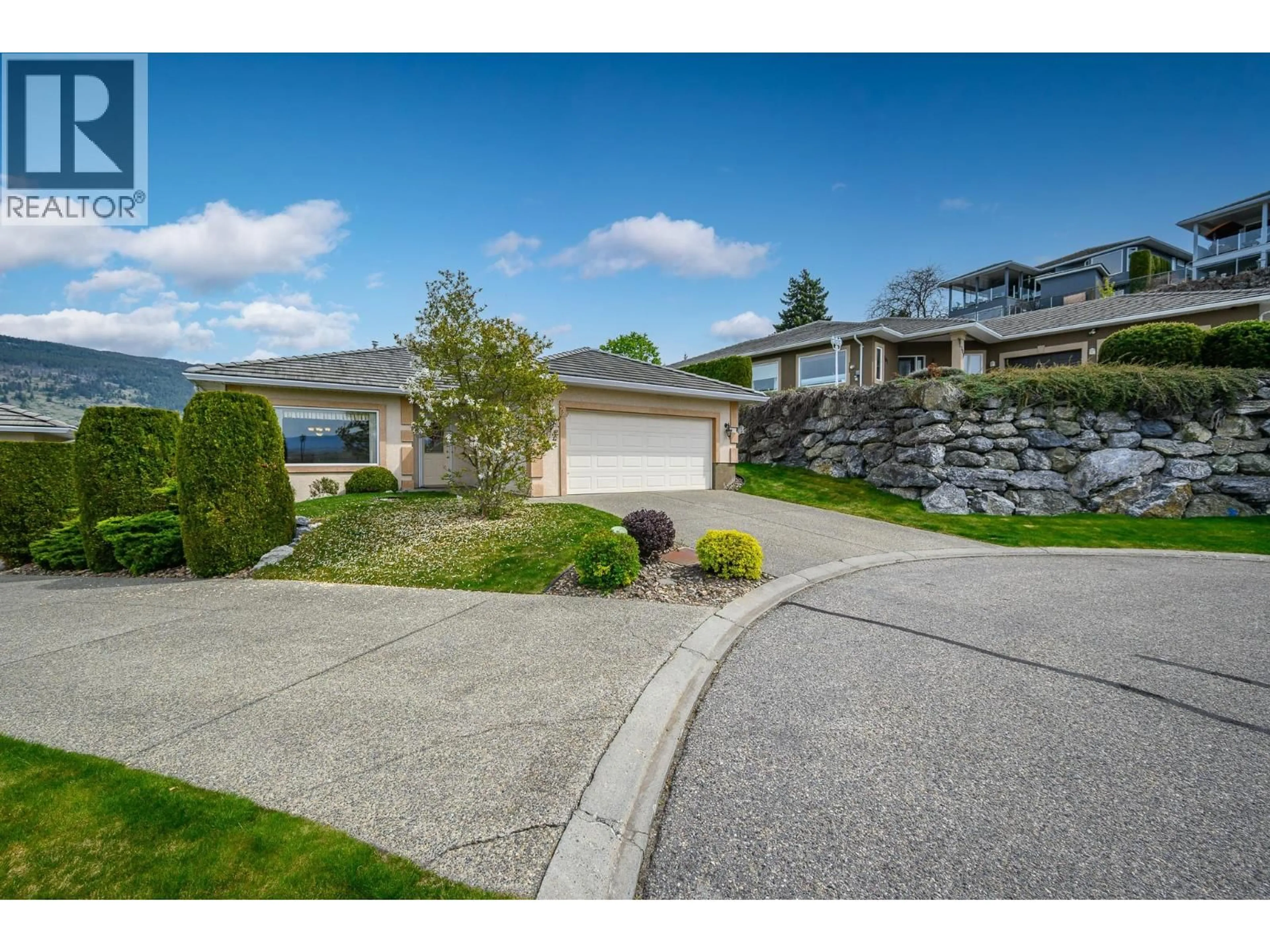 A pic from outside/outdoor area/front of a property/back of a property/a pic from drone, street for 102 - 124 SARSONS ROAD, Vernon British Columbia V1B2T9