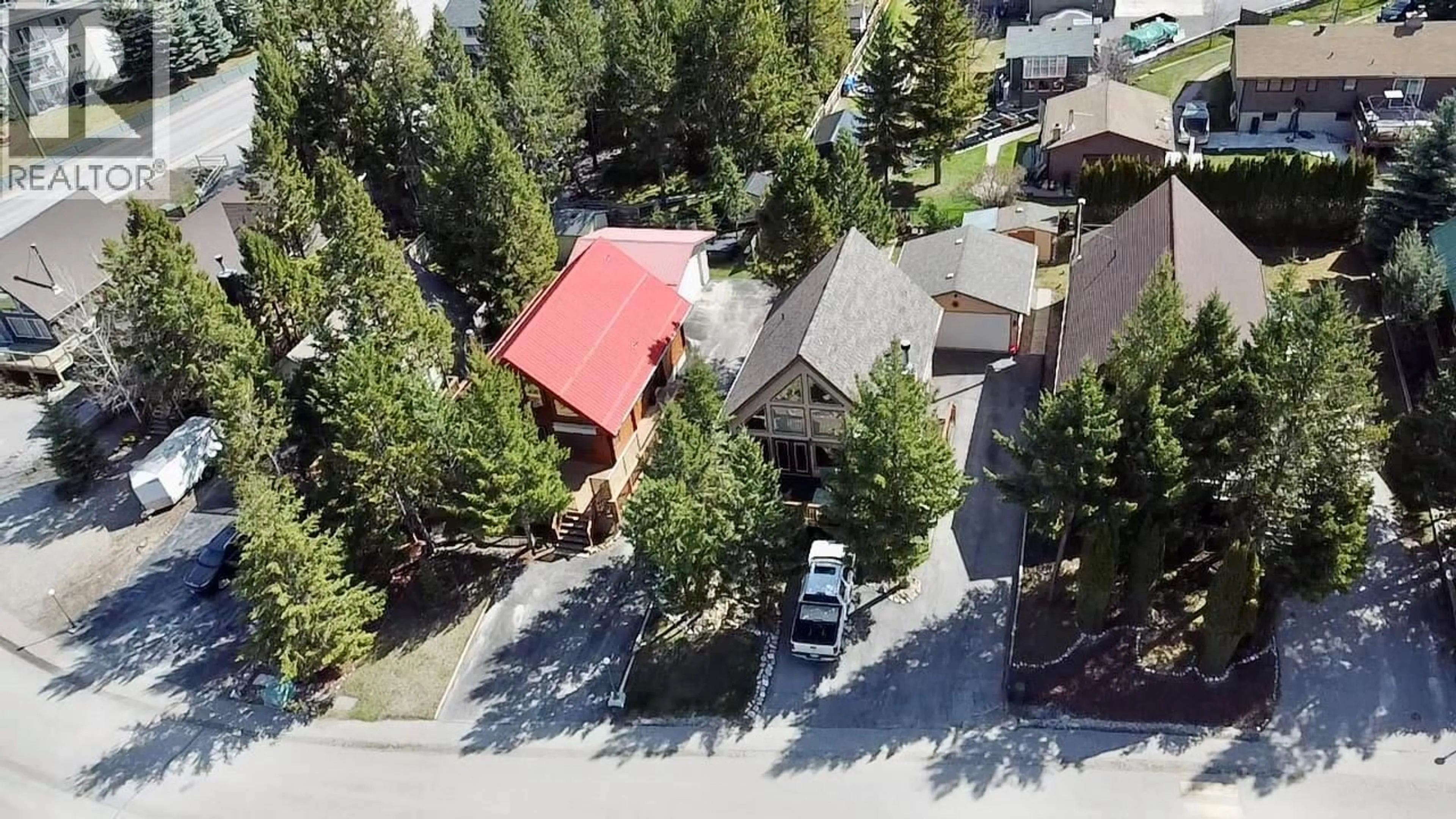 A pic from outside/outdoor area/front of a property/back of a property/a pic from drone, street for 7490 PINE CONE LANE, Radium Hot Springs British Columbia V0A1M0