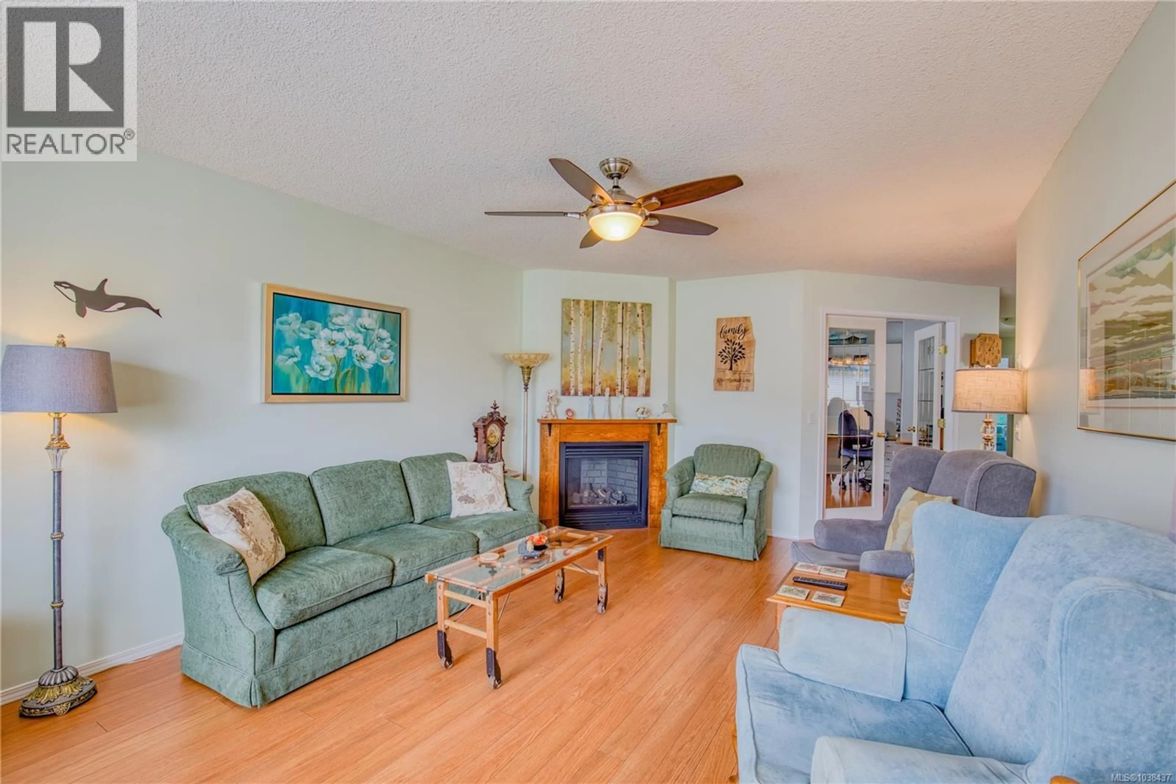 Living room with furniture, wood/laminate floor for 3896 KING ARTHUR DRIVE, Nanaimo British Columbia V9T6B9