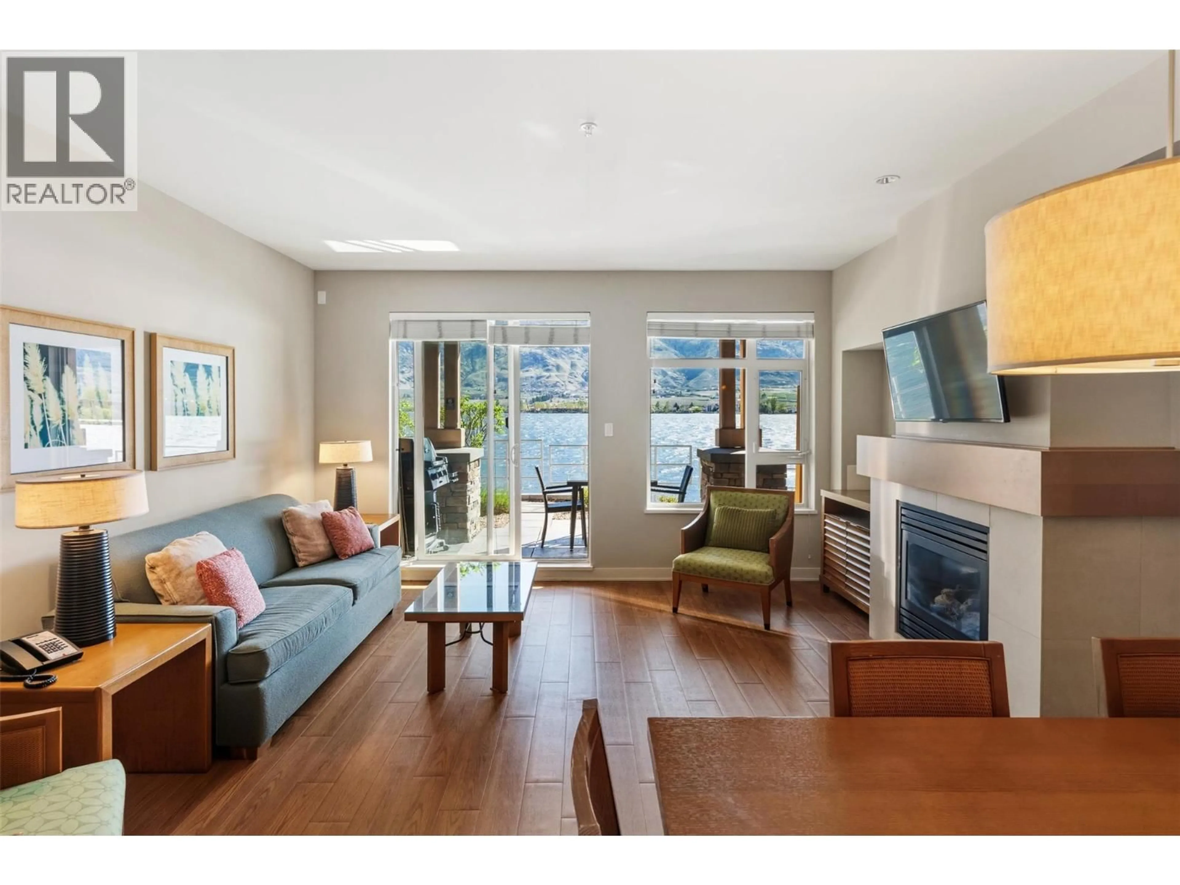 Living room with furniture, wood/laminate floor for 54 - 15 PARK PLACE, Osoyoos British Columbia V0H1V0