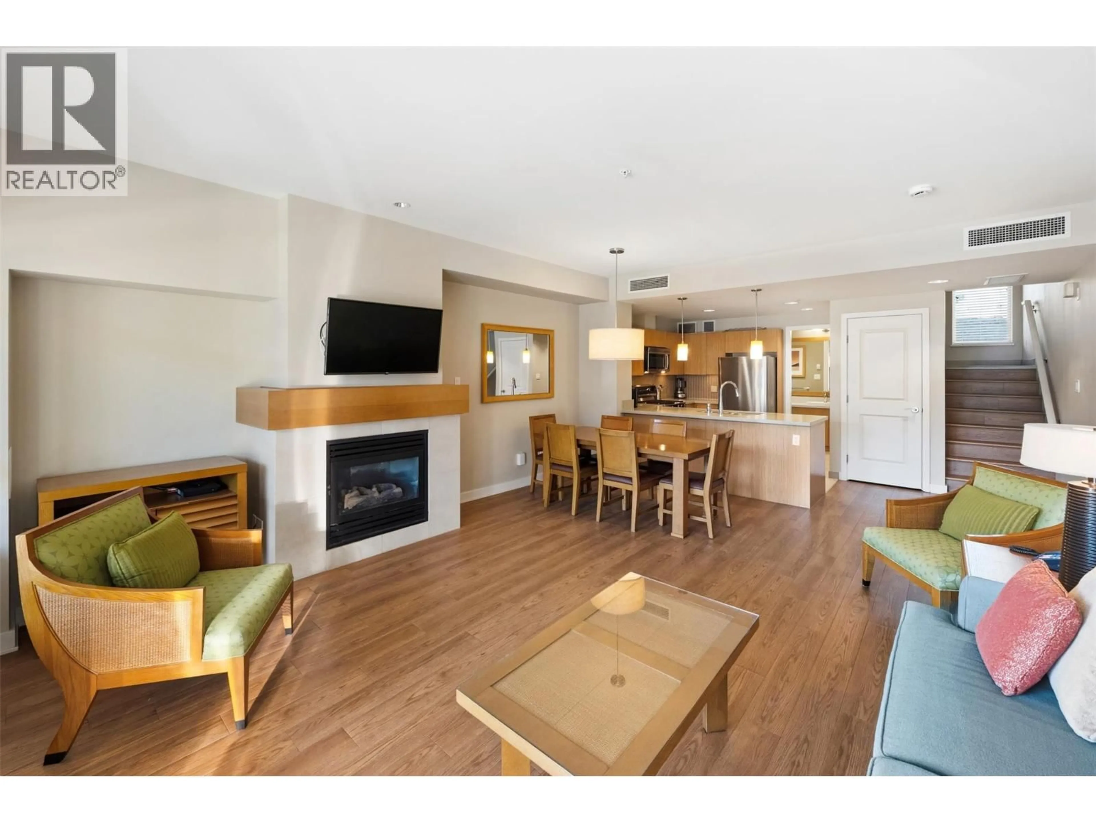 Living room with furniture, wood/laminate floor for 54 - 15 PARK PLACE, Osoyoos British Columbia V0H1V0