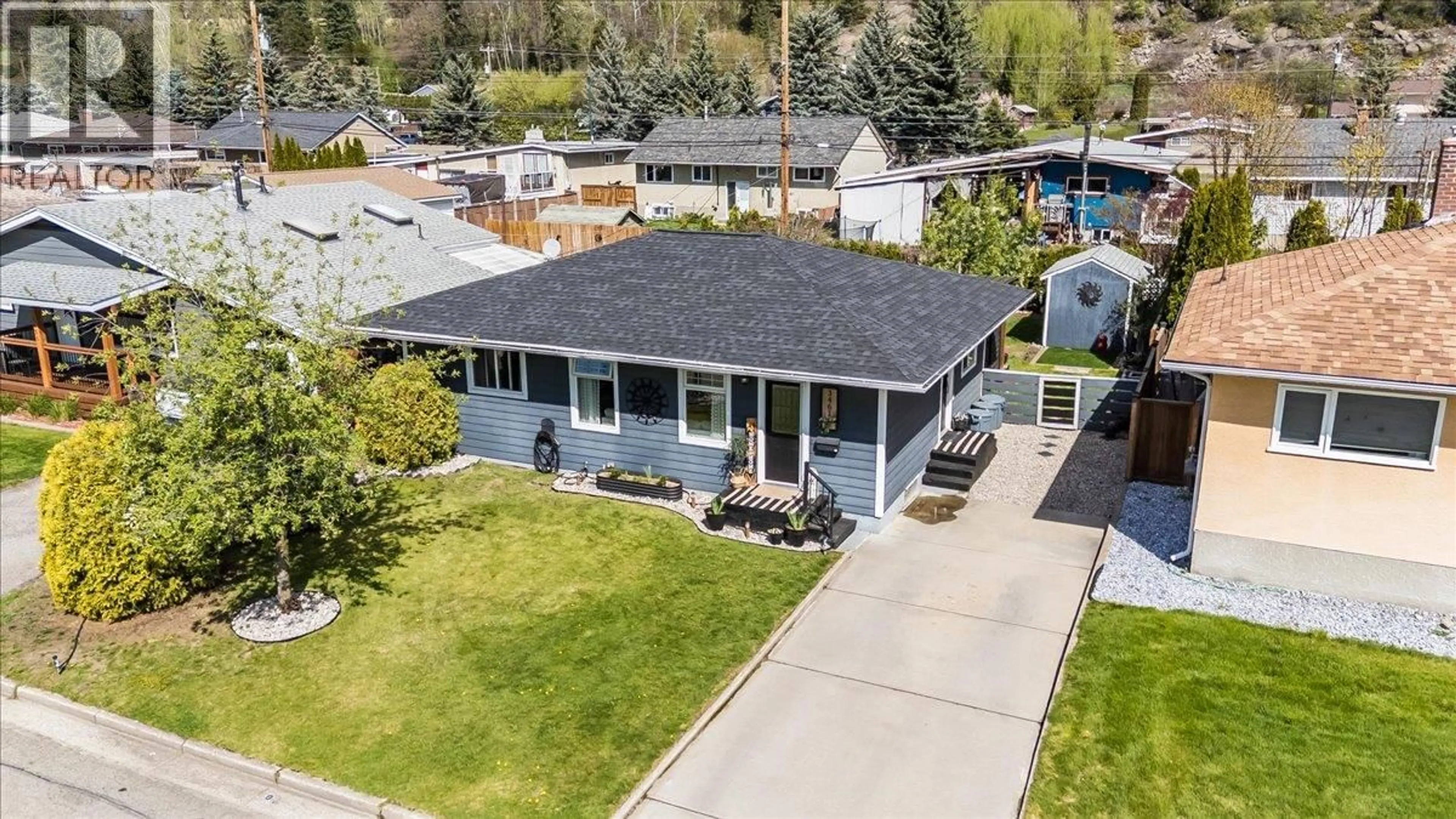 A pic from outside/outdoor area/front of a property/back of a property/a pic from drone, street for 3461 ASTER DRIVE, Trail British Columbia V1R2X2