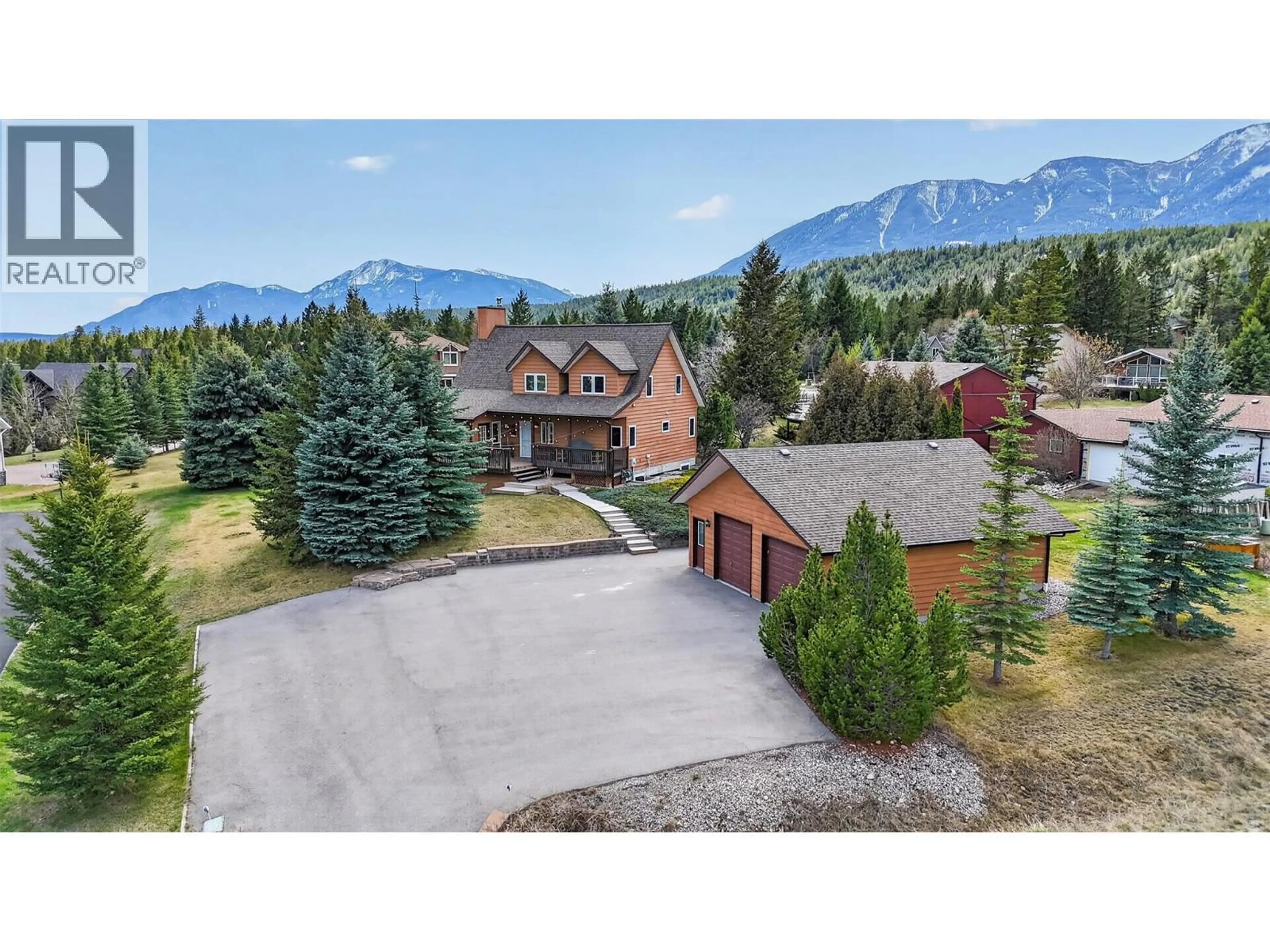 A pic from outside/outdoor area/front of a property/back of a property/a pic from drone, mountain view for 4484 SPRUCE BAY, Fairmont Hot Springs British Columbia V0B1L2
