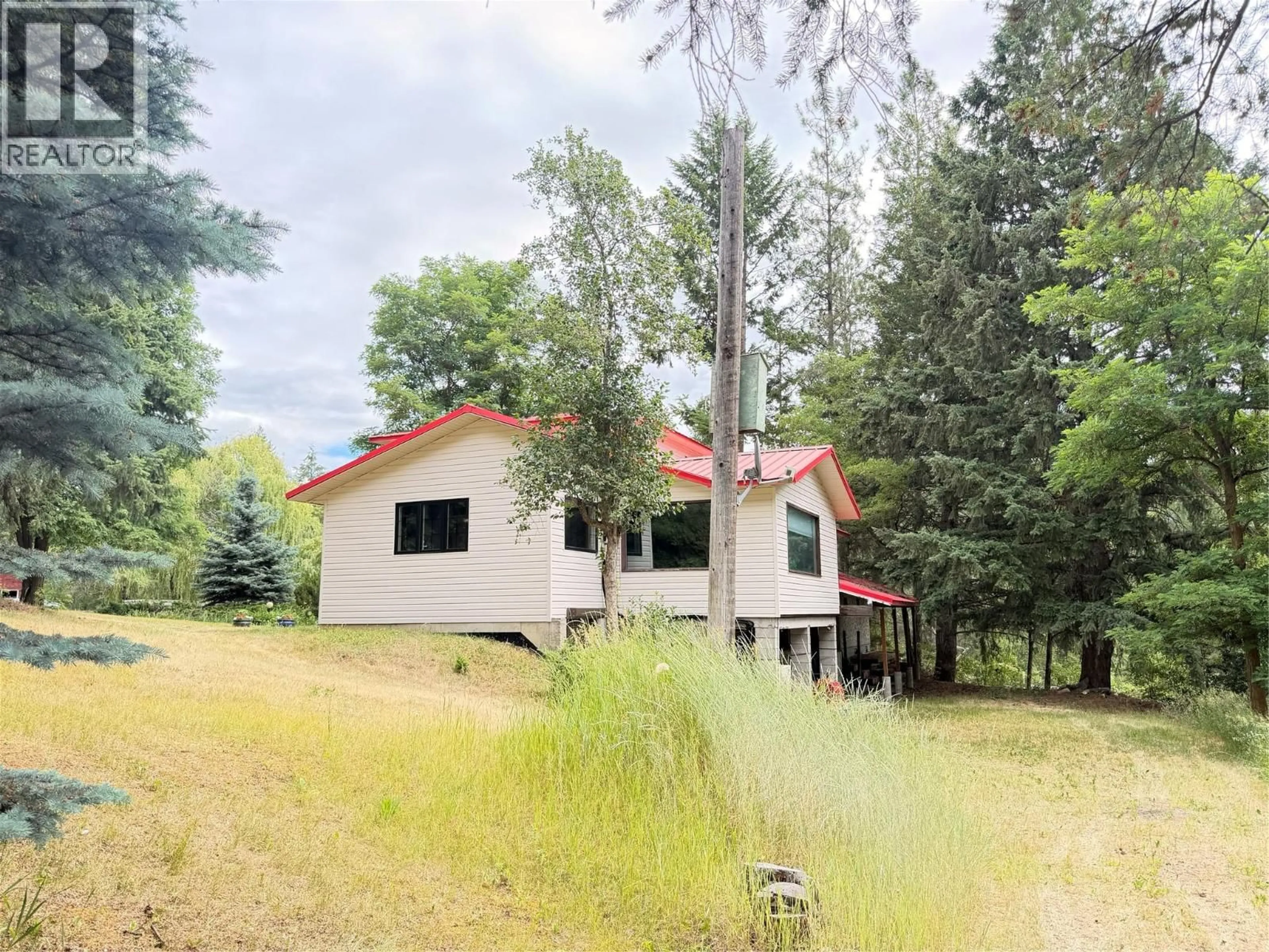 A pic from outside/outdoor area/front of a property/back of a property/a pic from drone, forest/trees view for 2860 HIGHWAY 97 NORTH OTHER, Falkland British Columbia V4Y0X3