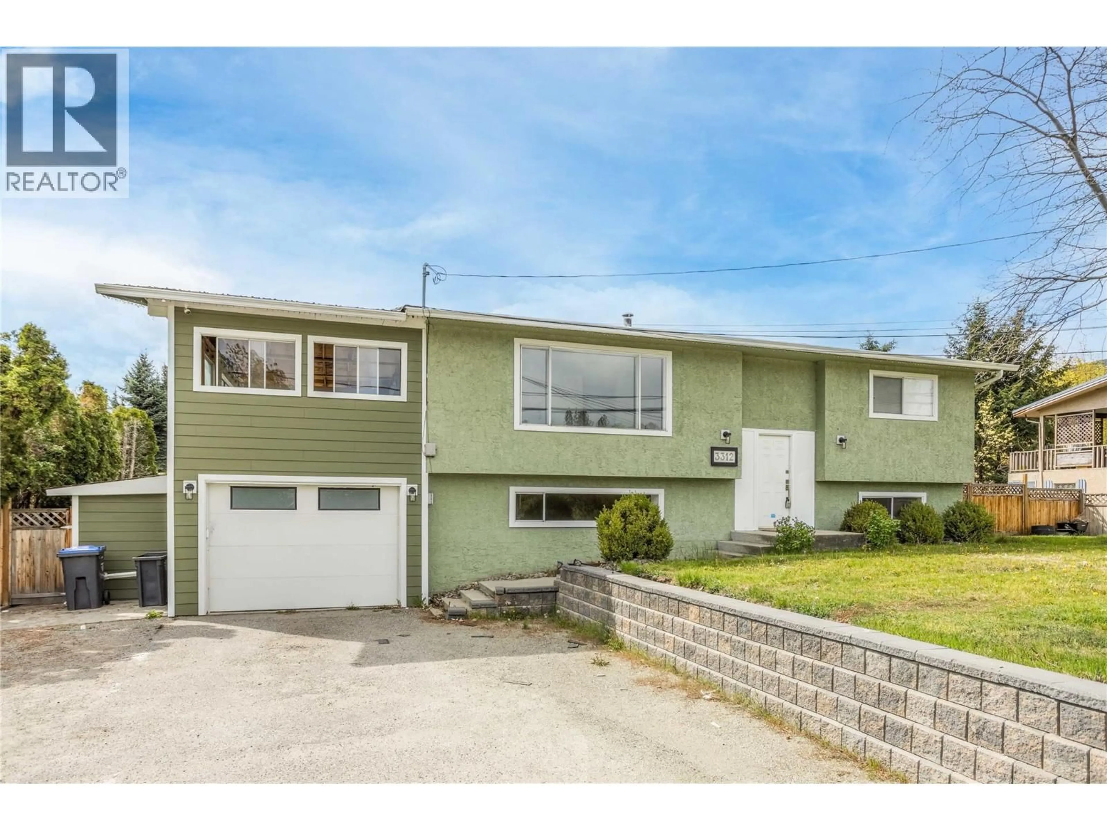 Home with vinyl exterior material, street for 3312 OLD OKANAGAN HIGHWAY, West Kelowna British Columbia V4T1N2