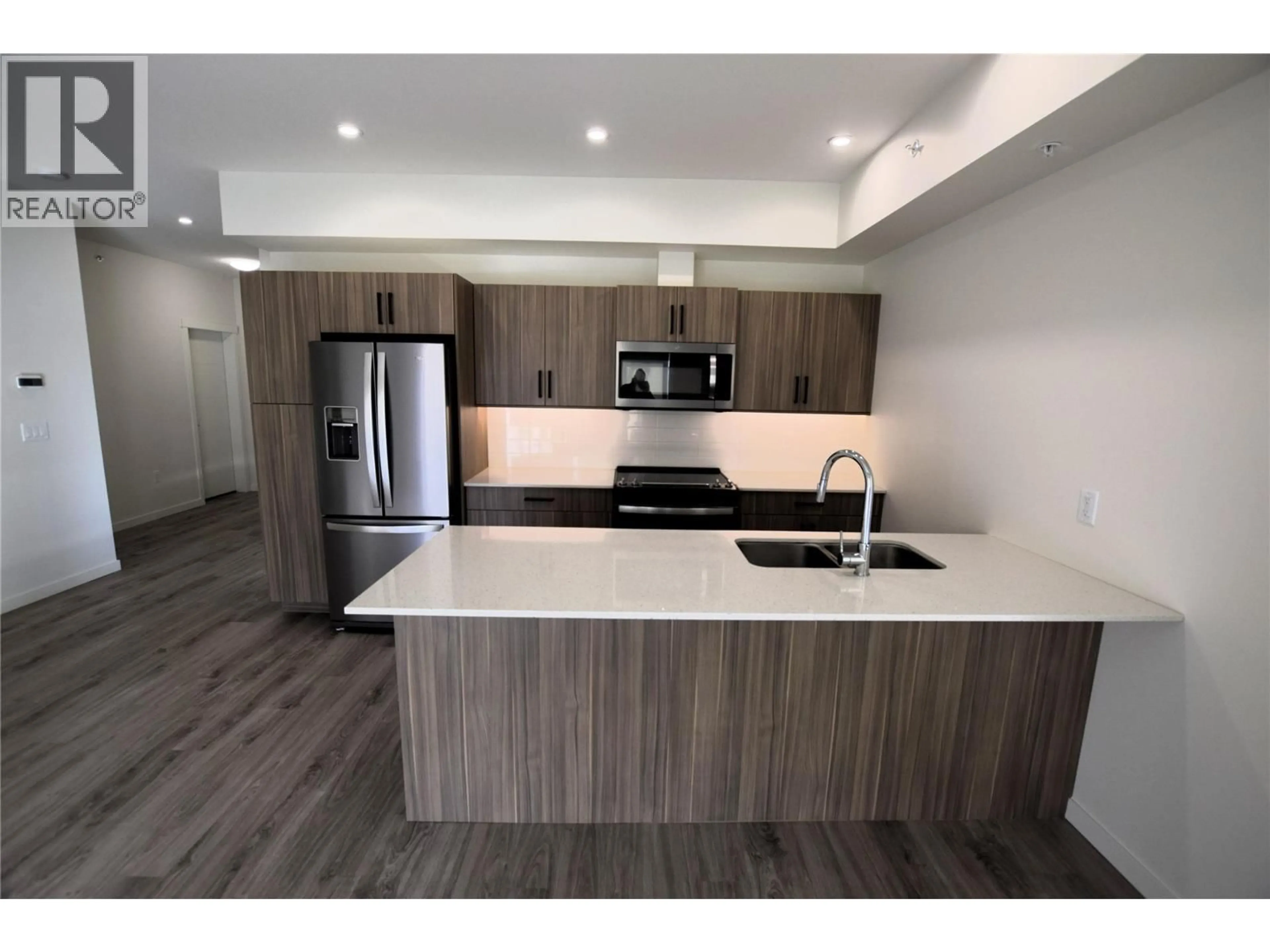 Open concept kitchen, wood/laminate floor for 515 - 2345 BUTT ROAD, Westbank British Columbia V4T0G4