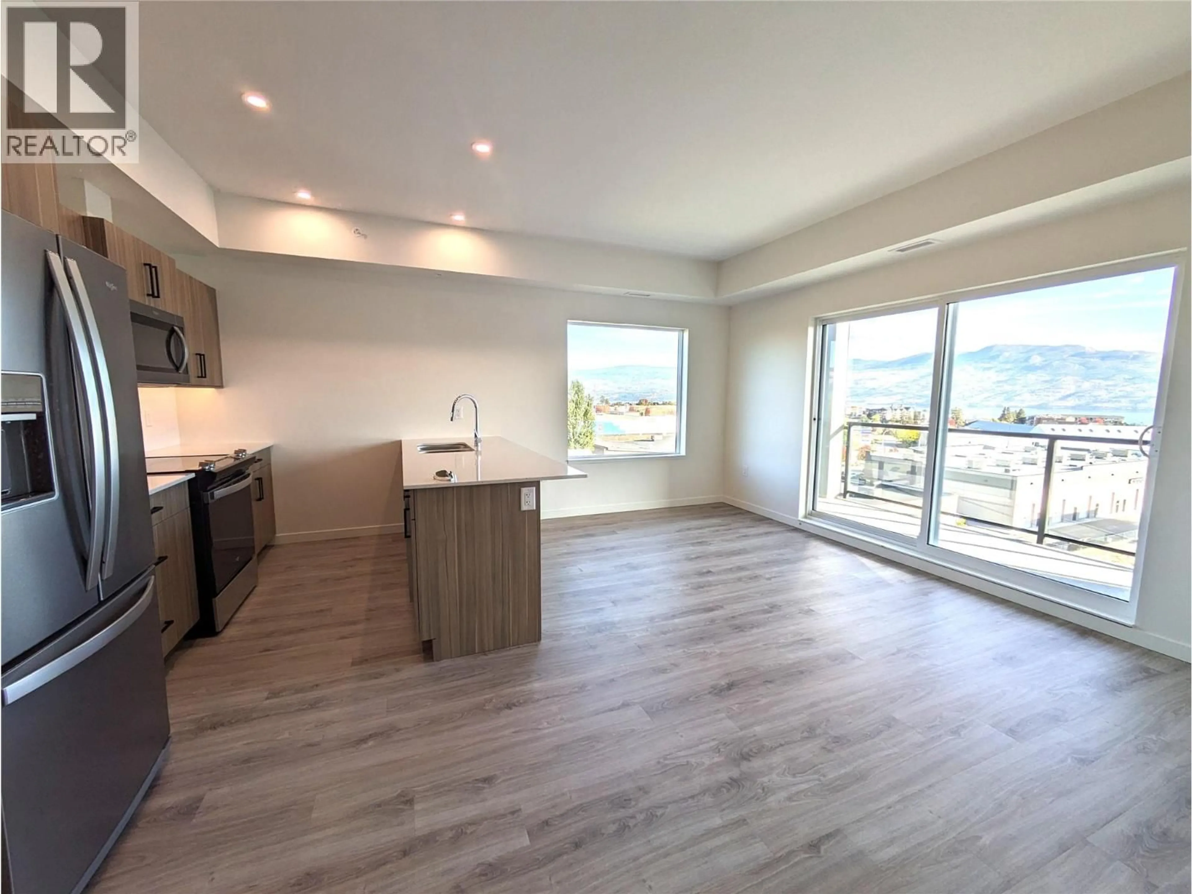 Open concept kitchen, wood/laminate floor for 515 - 2345 BUTT ROAD, Westbank British Columbia V4T0G4