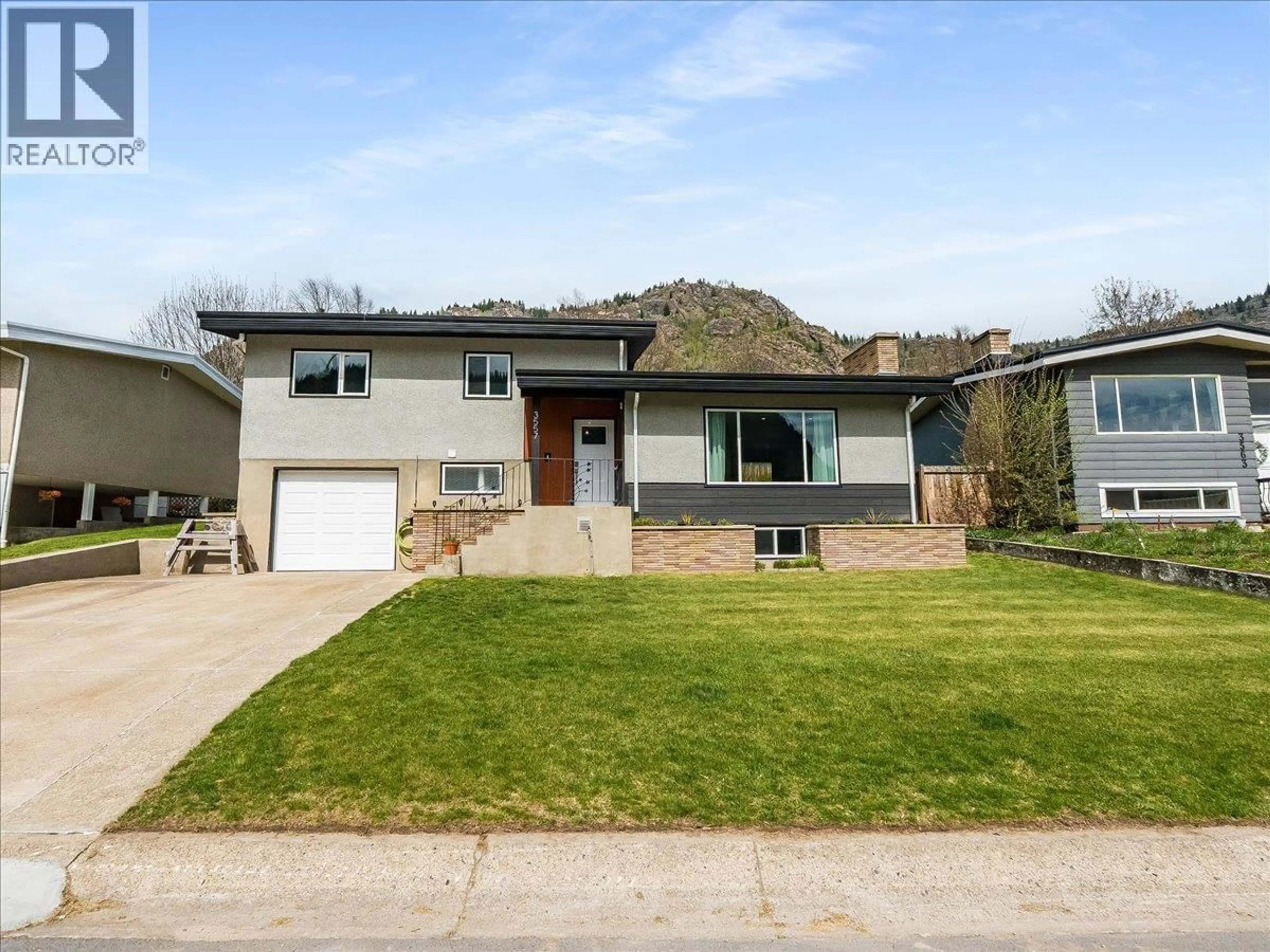 Home with vinyl exterior material, street for 3557 HIGHWAY DRIVE, Trail British Columbia V1R2T9