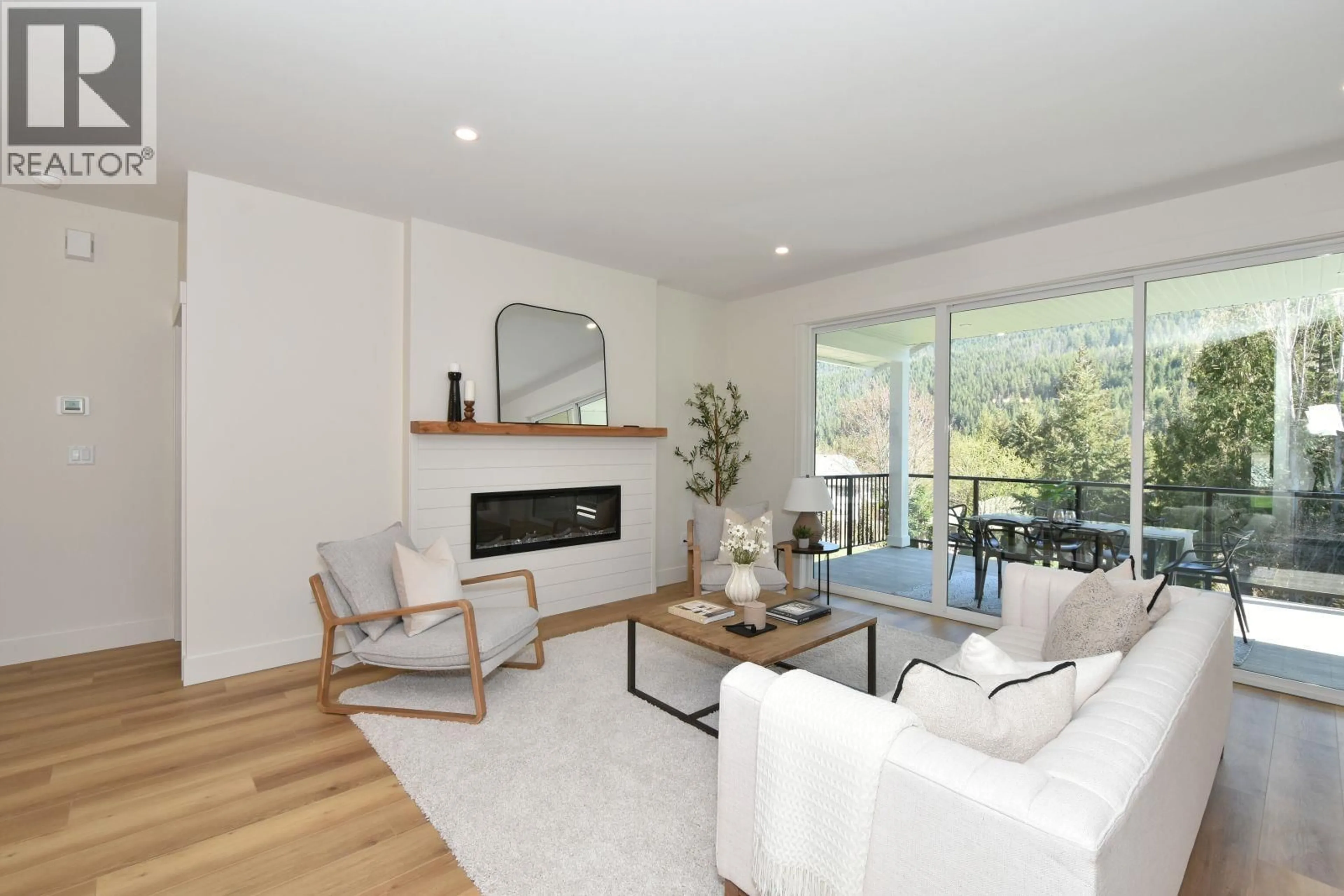 Living room with furniture, wood/laminate floor for 2799 MOUNTVIEW DRIVE, Blind Bay British Columbia V0E1H1