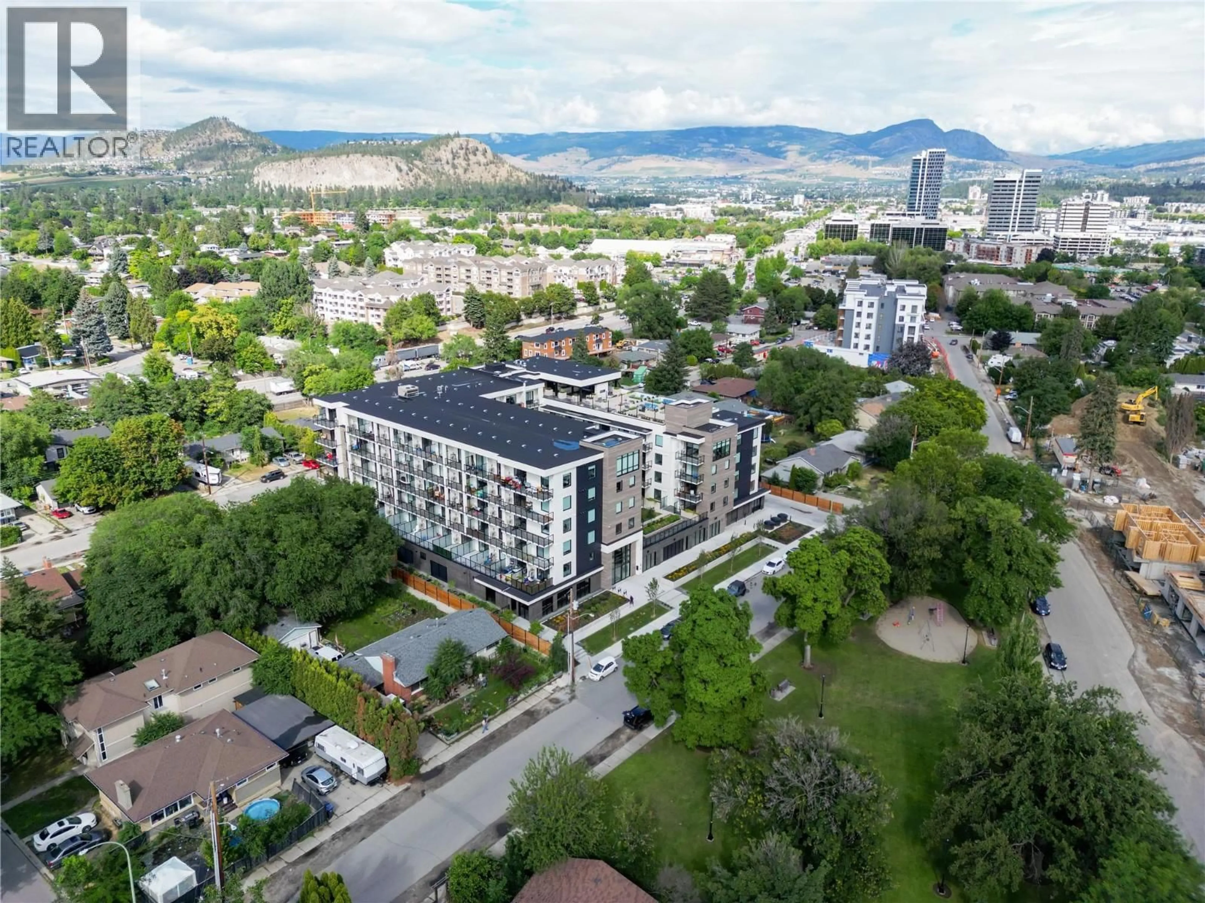 A pic from outside/outdoor area/front of a property/back of a property/a pic from drone, mountain view for 514 - 1274 DEVONSHIRE AVENUE, Kelowna British Columbia V1Y0M7
