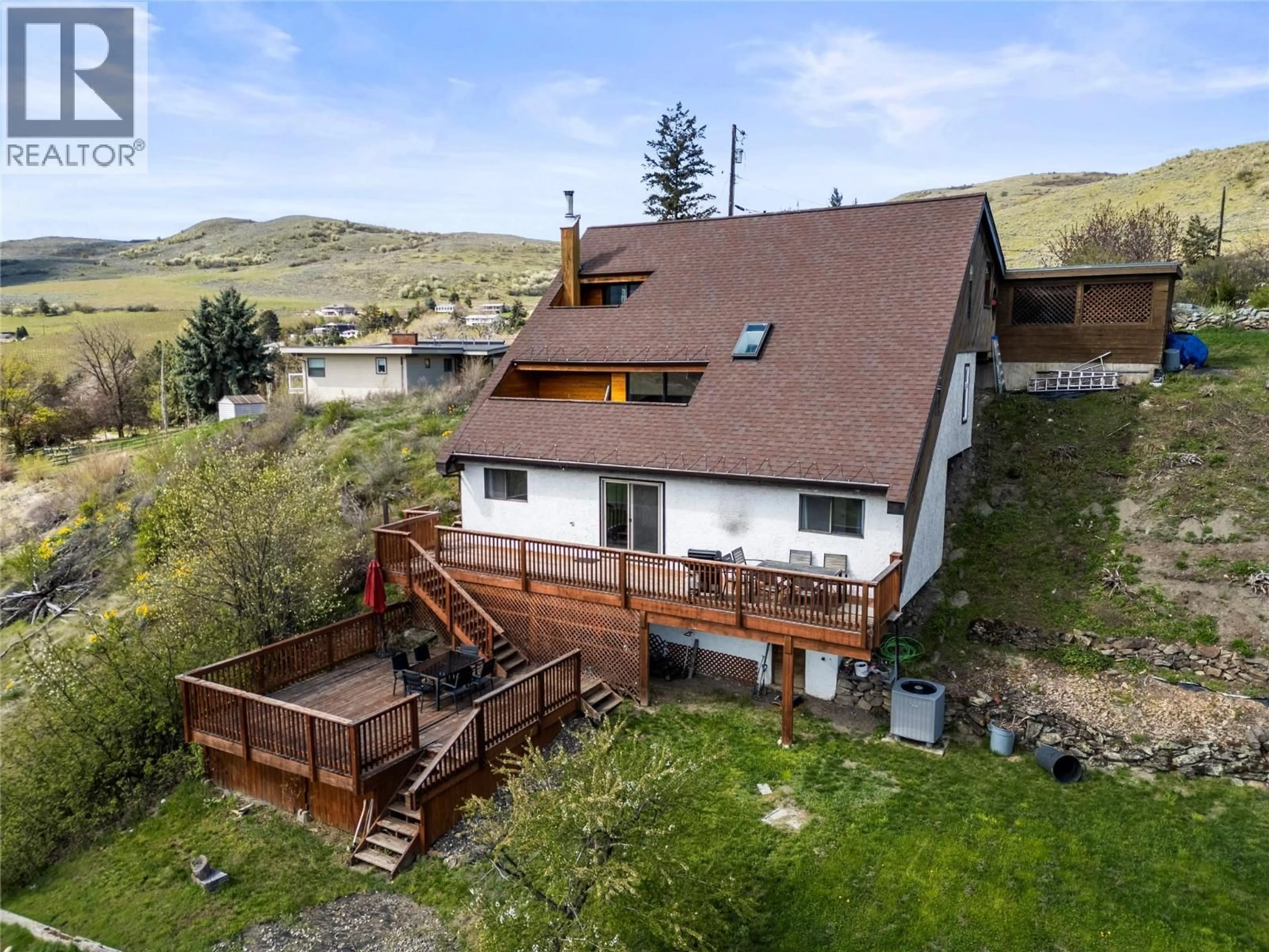 A pic from outside/outdoor area/front of a property/back of a property/a pic from drone, mountain view for 6515 EAGLE ROAD, Vernon British Columbia V1H1W4
