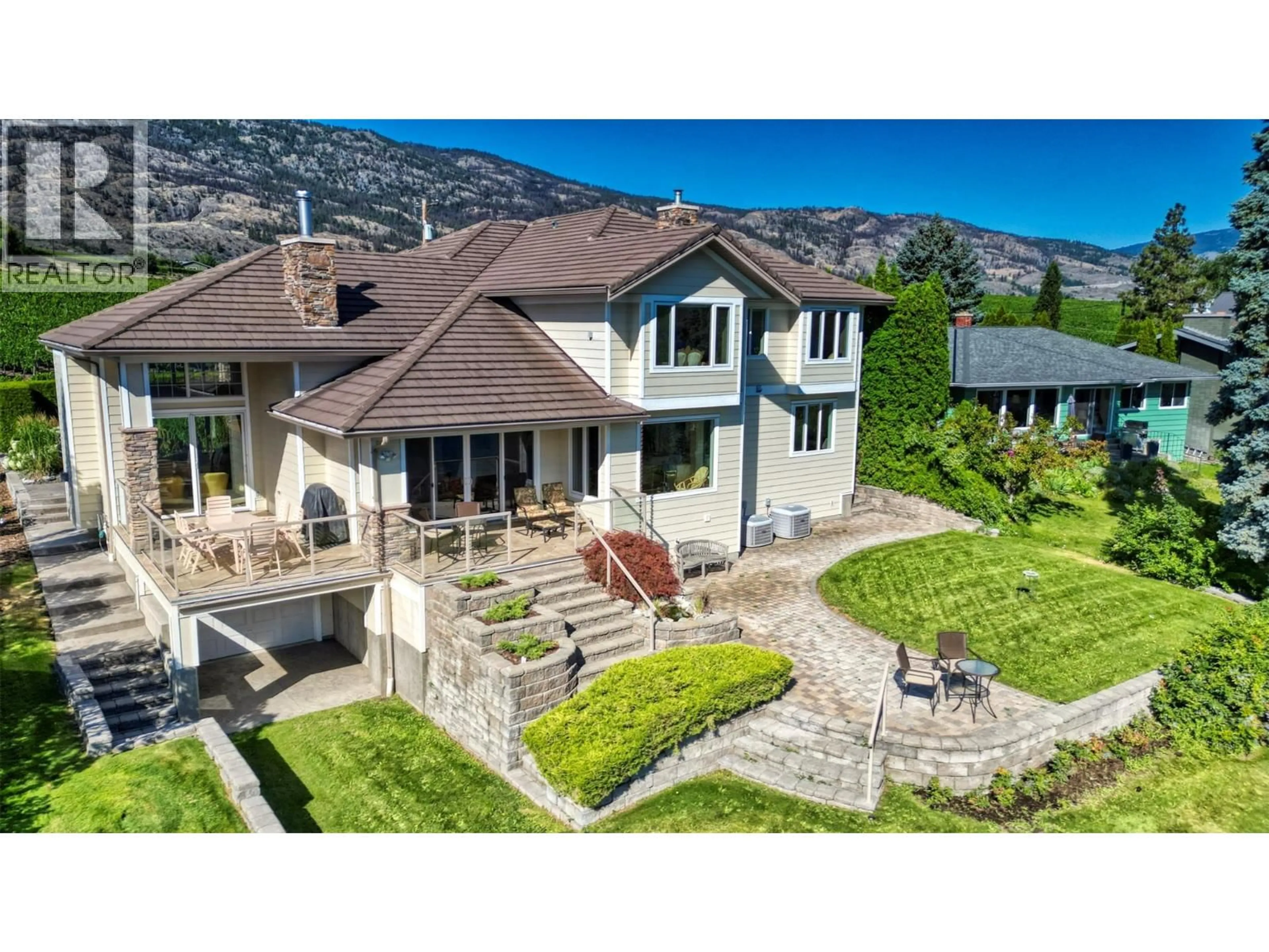 A pic from outside/outdoor area/front of a property/back of a property/a pic from drone, mountain view for 10411 81ST STREET, Osoyoos British Columbia V0H1V2