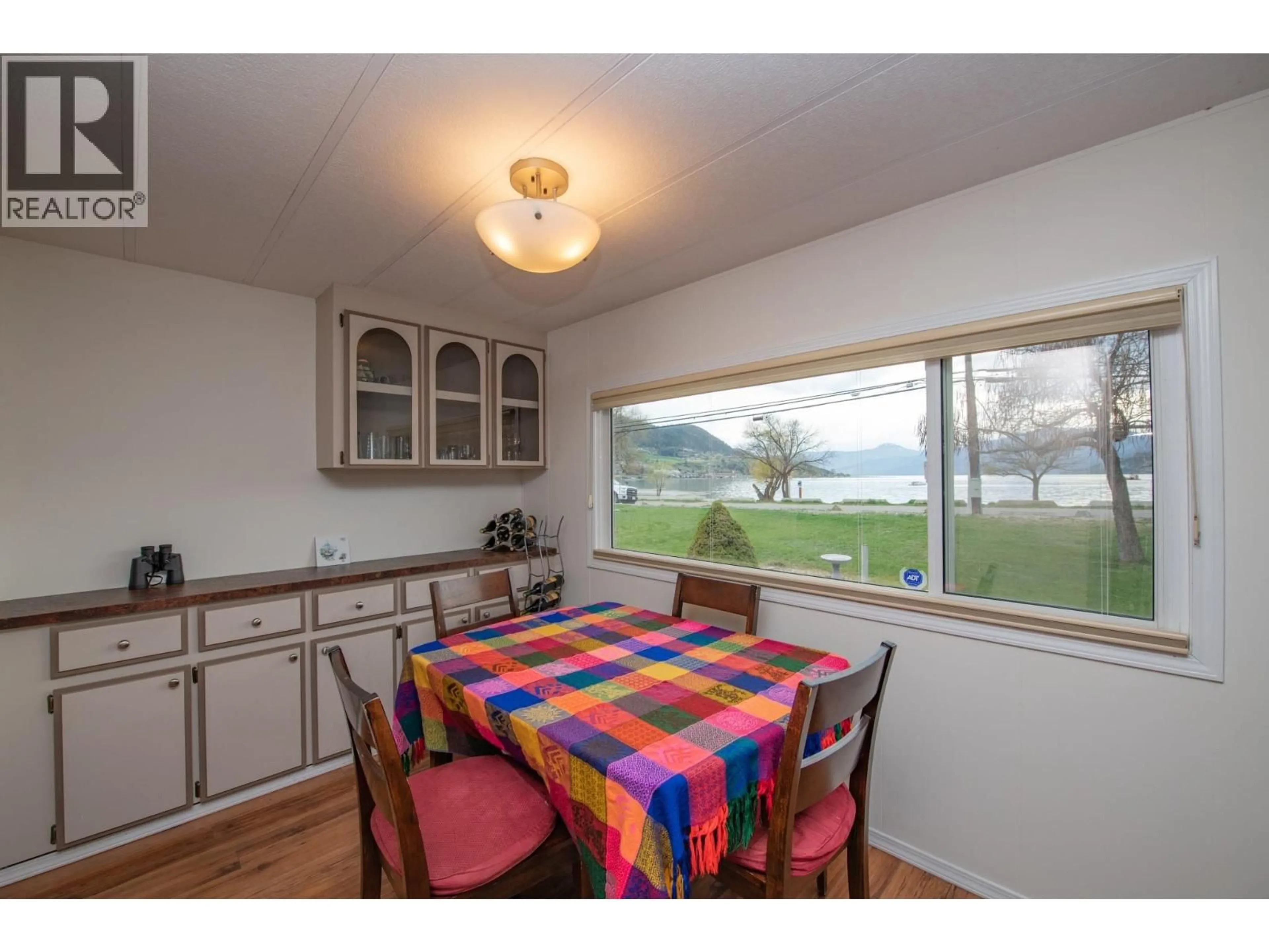 Dining room, wood/laminate floor for 48 - 2727 LAKESHORE ROAD, Vernon British Columbia V1H1X5