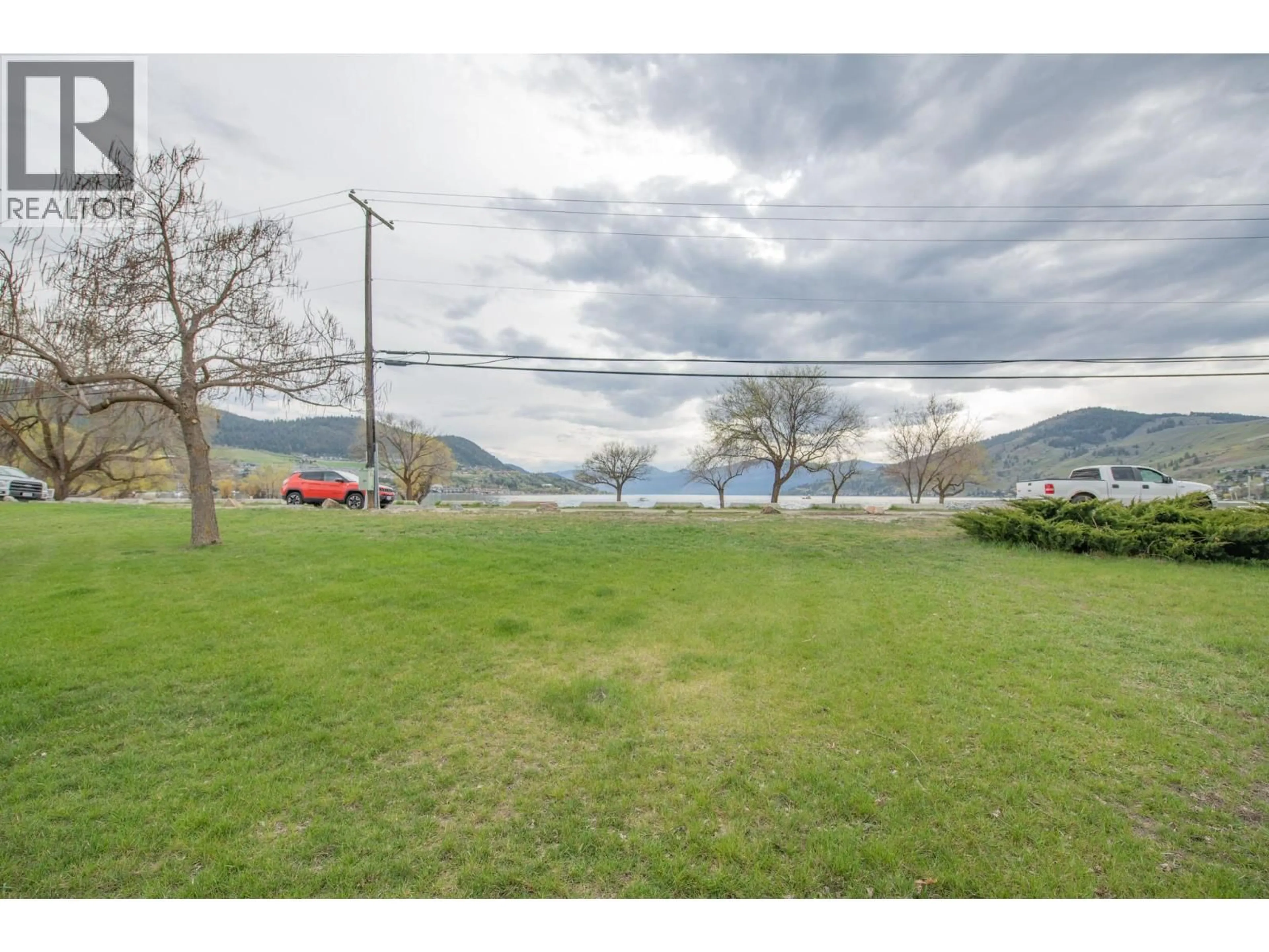 A pic from outside/outdoor area/front of a property/back of a property/a pic from drone, water/lake/river/ocean view for 48 - 2727 LAKESHORE ROAD, Vernon British Columbia V1H1X5