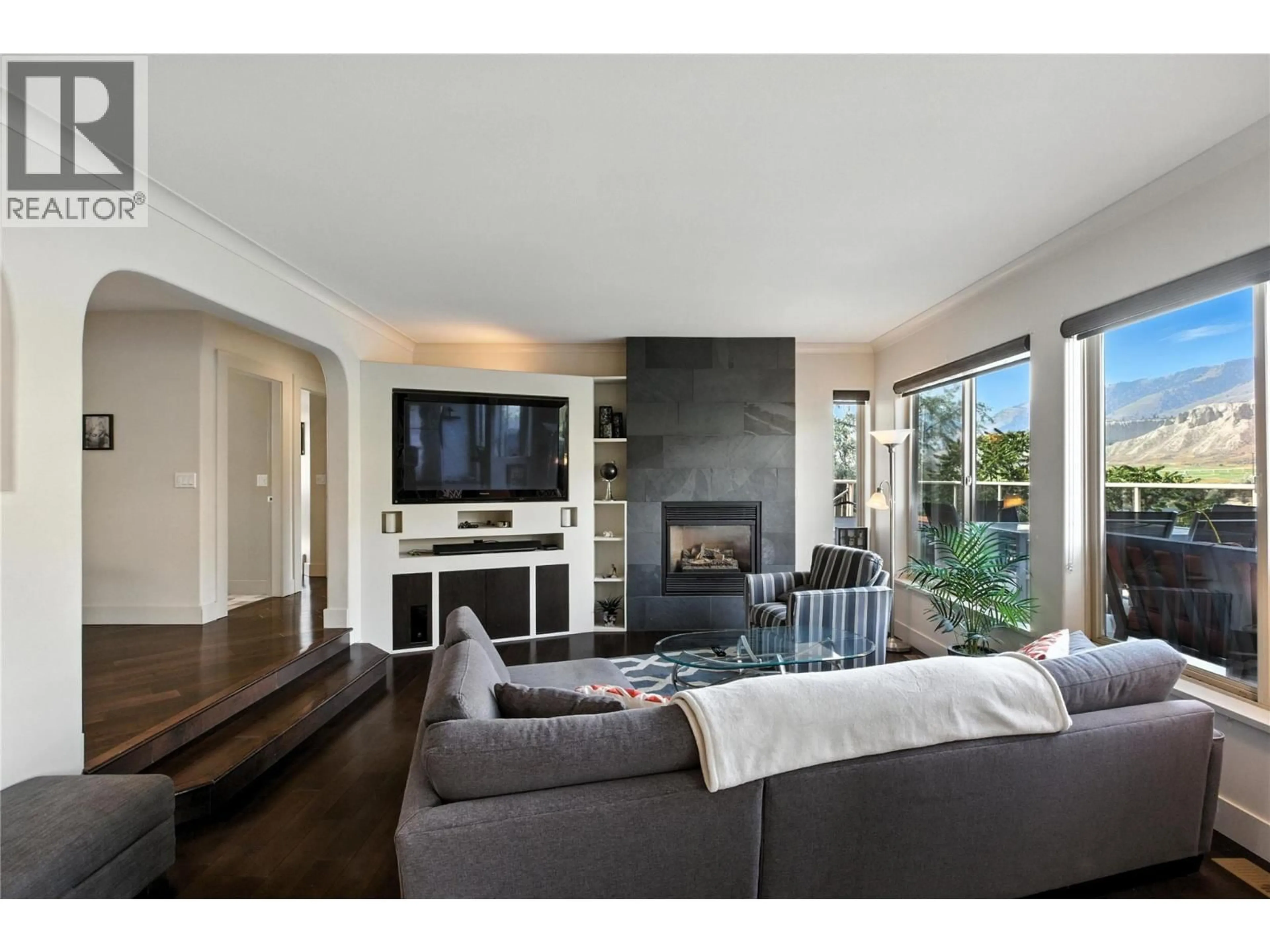 Living room with furniture, wood/laminate floor for 4990 KIPP ROAD, Kamloops British Columbia V2C4T2