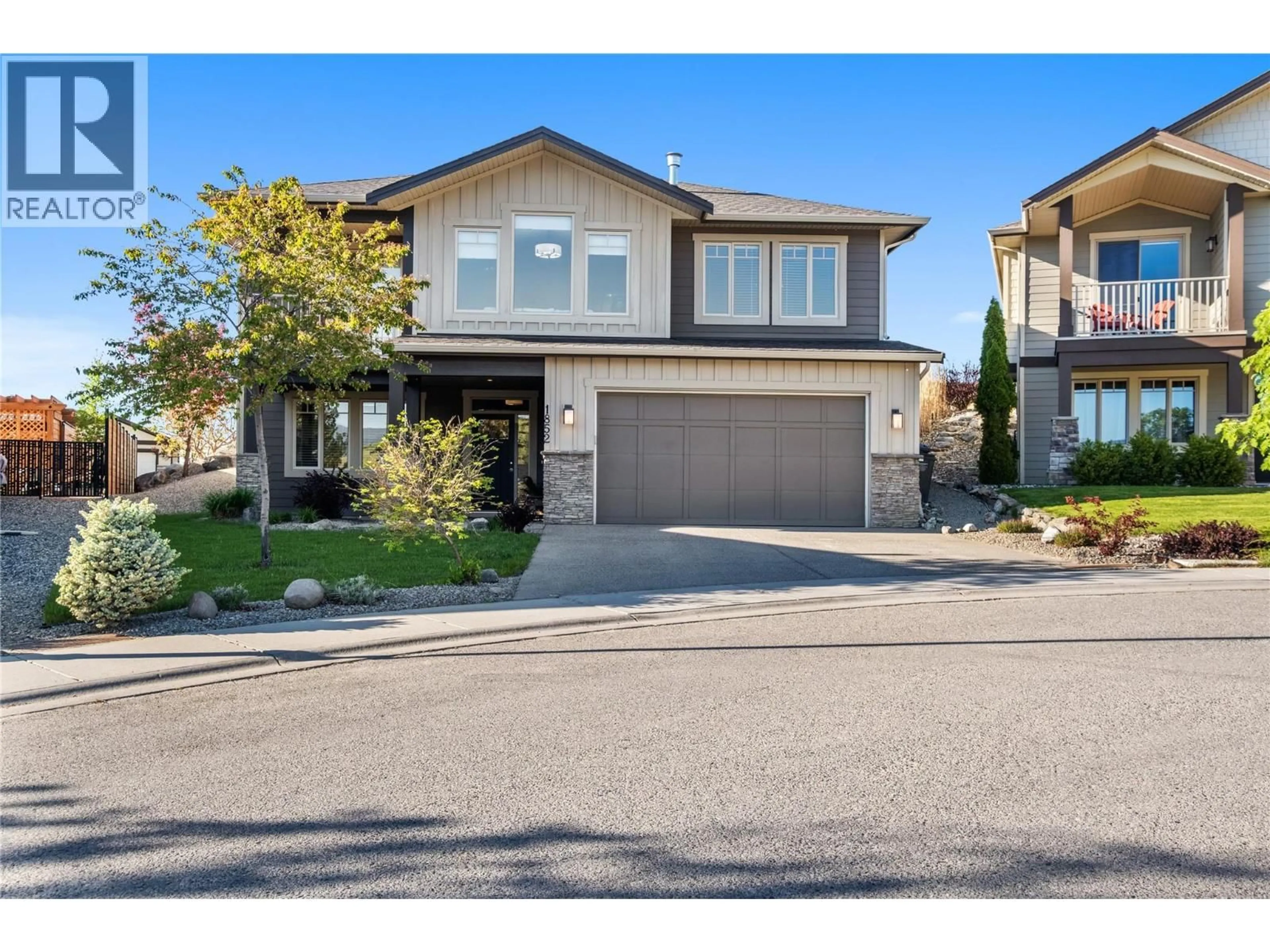 Home with vinyl exterior material, street for 1852 SPLIT RAIL PLACE, Kelowna British Columbia V1P1R1