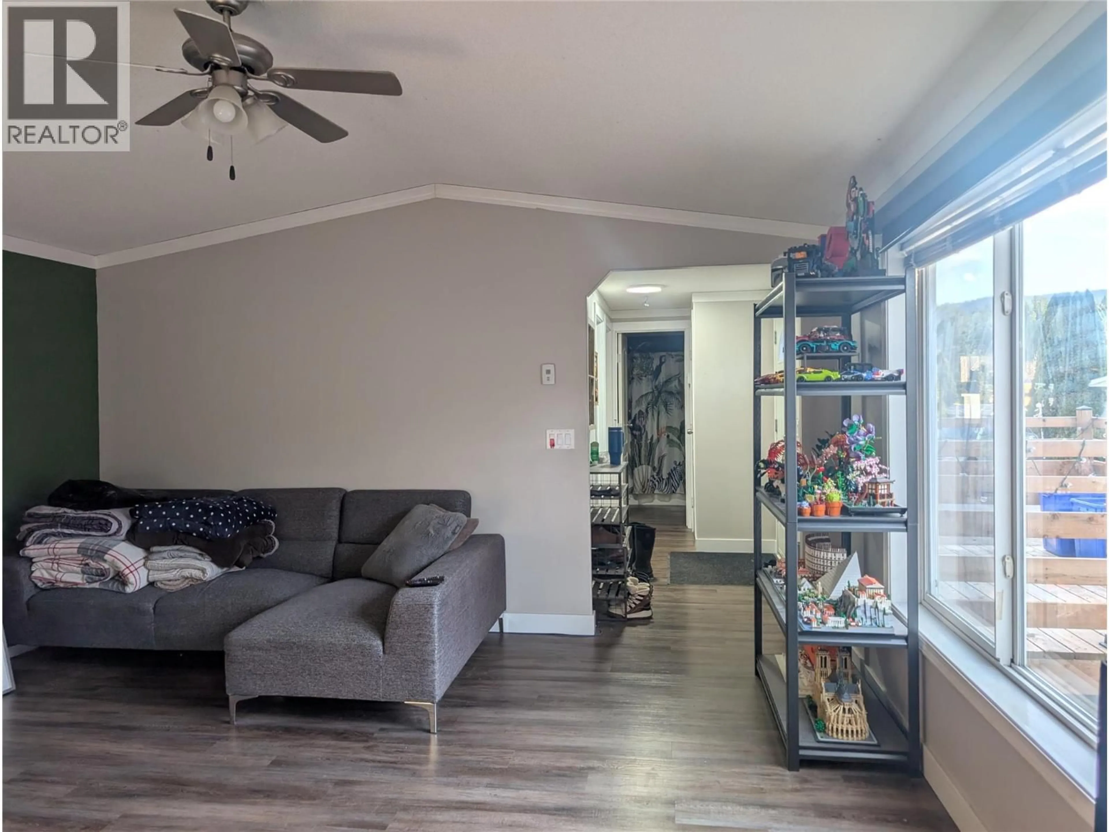 Living room with furniture, wood/laminate floor for A9 - 446 MABEL LAKE ROAD, Lumby British Columbia V0E2G5