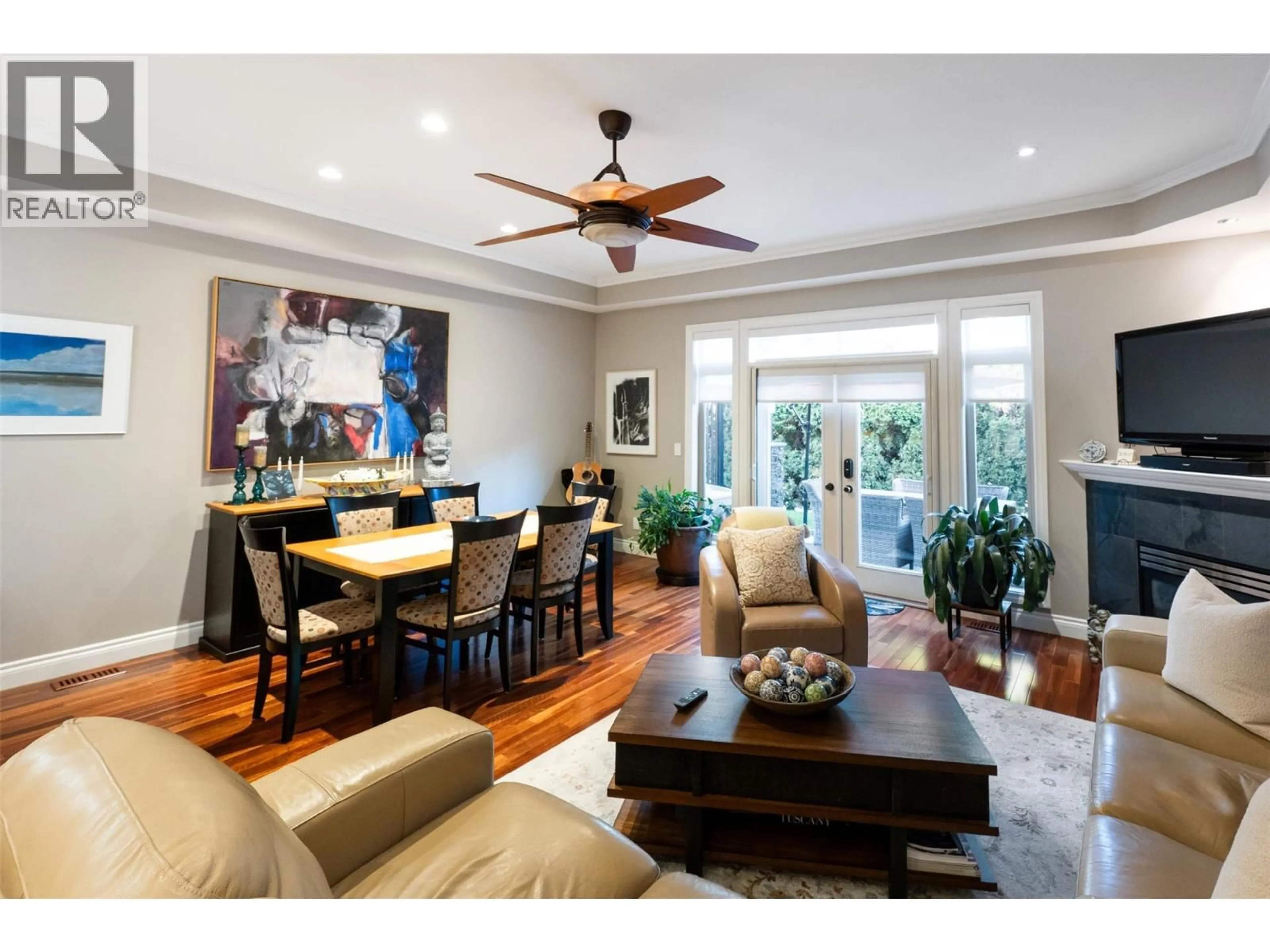 Living room with furniture, wood/laminate floor for 105 - 2629 CORNWALL DRIVE, Penticton British Columbia V2A6J3