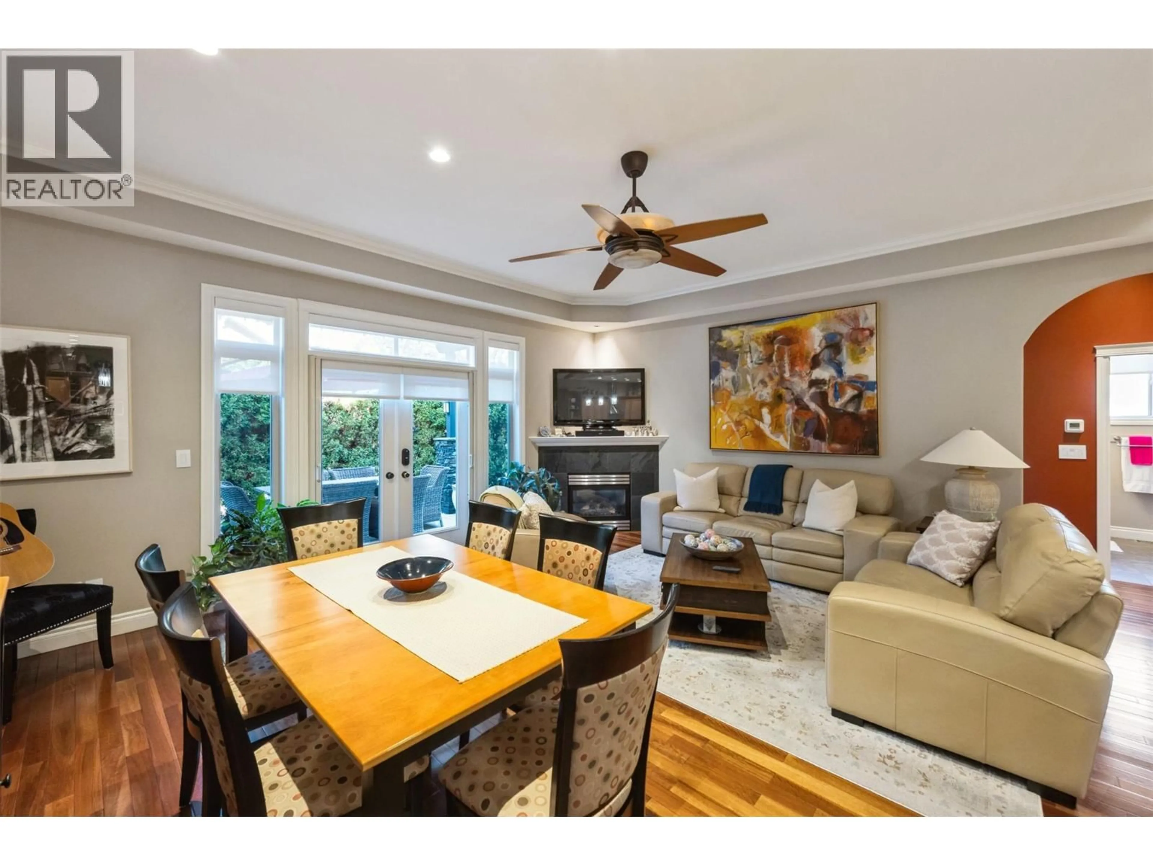 Living room with furniture, wood/laminate floor for 105 - 2629 CORNWALL DRIVE, Penticton British Columbia V2A6J3