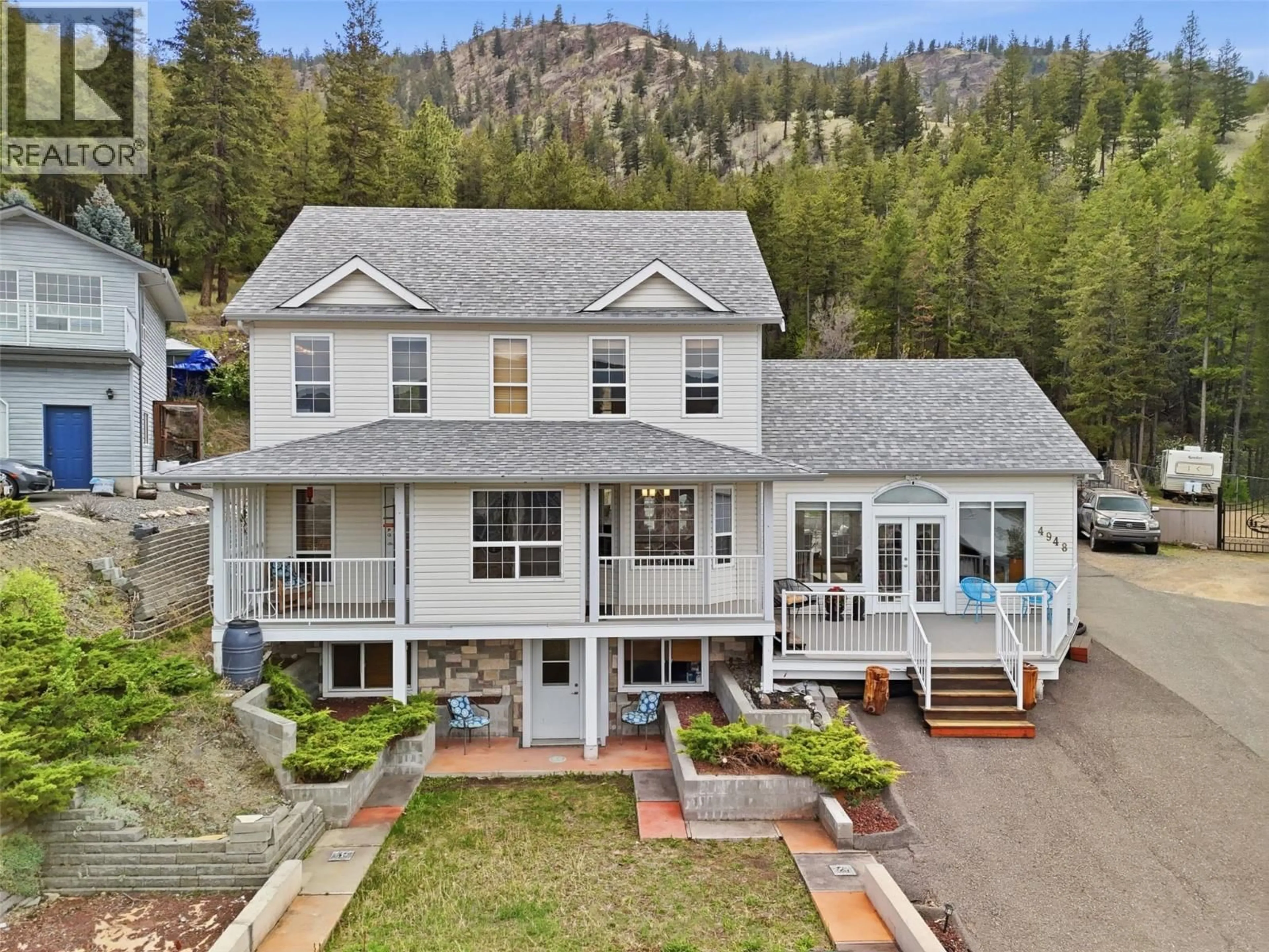 A pic from outside/outdoor area/front of a property/back of a property/a pic from drone, mountain view for 4948 WOODLAND COURT, Kamloops British Columbia V2C6V5