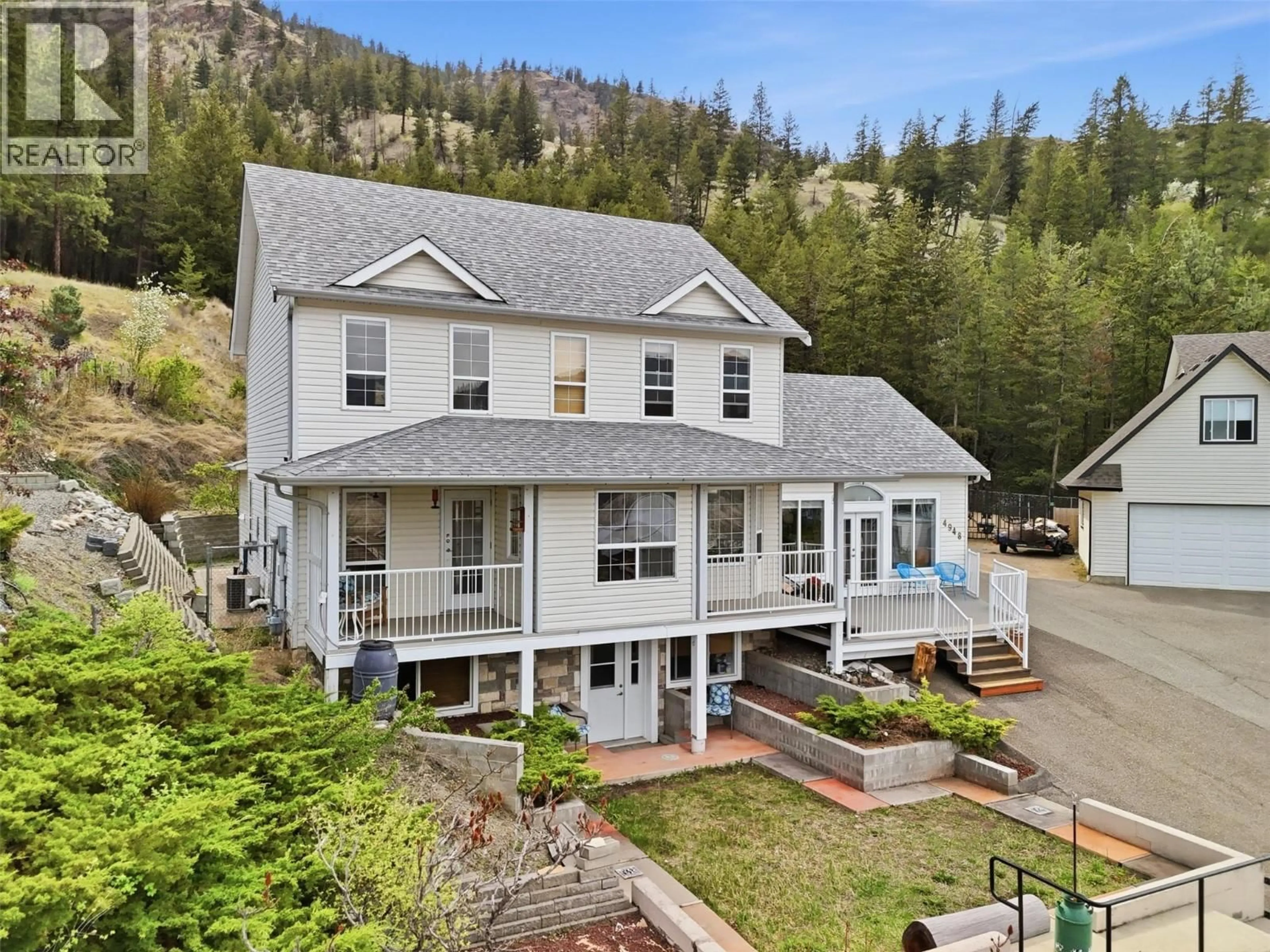A pic from outside/outdoor area/front of a property/back of a property/a pic from drone, mountain view for 4948 WOODLAND COURT, Kamloops British Columbia V2C6V5