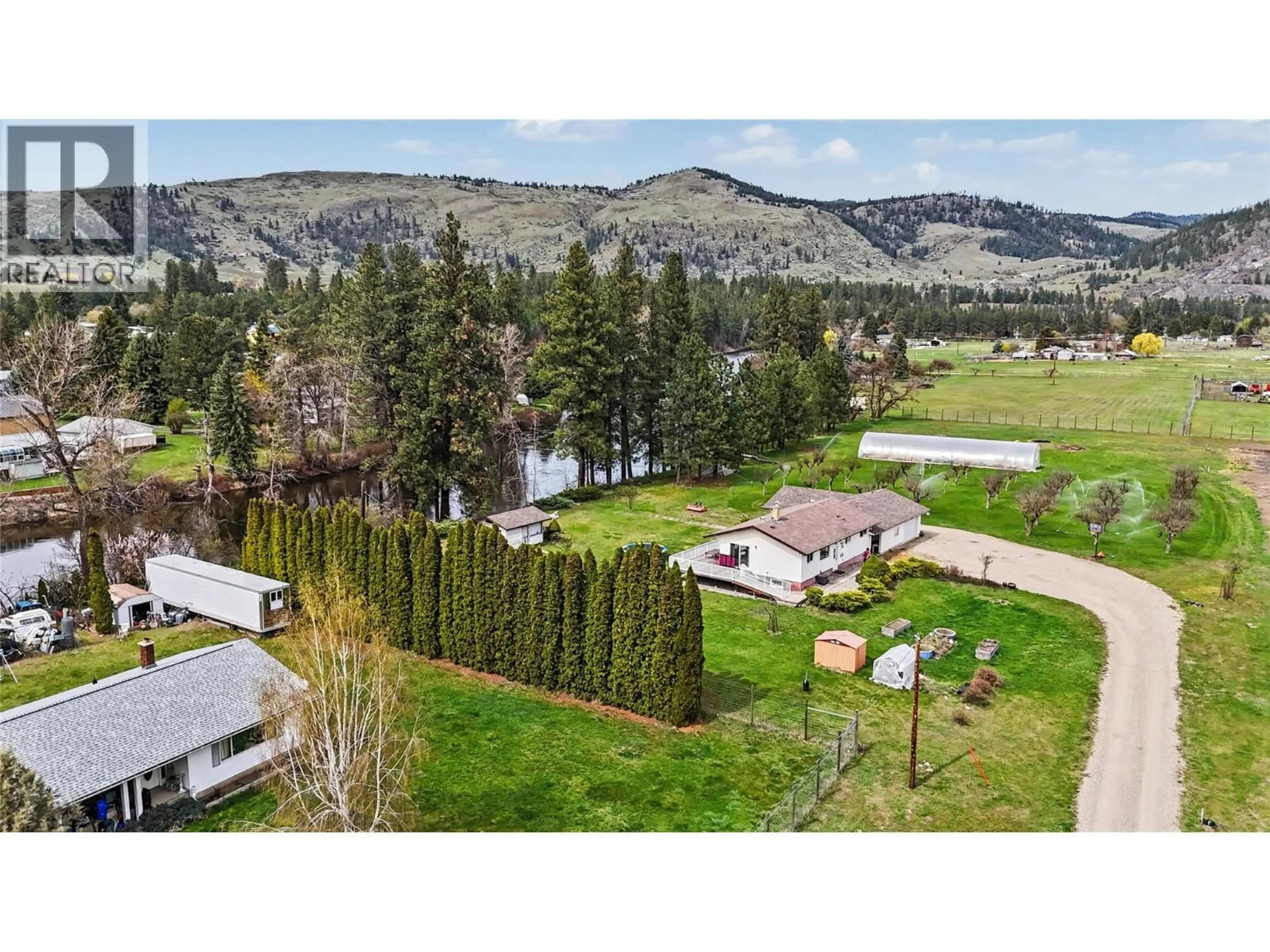 A pic from outside/outdoor area/front of a property/back of a property/a pic from drone, mountain view for 3845 CARSON ROAD, Grand Forks British Columbia V0H1H4