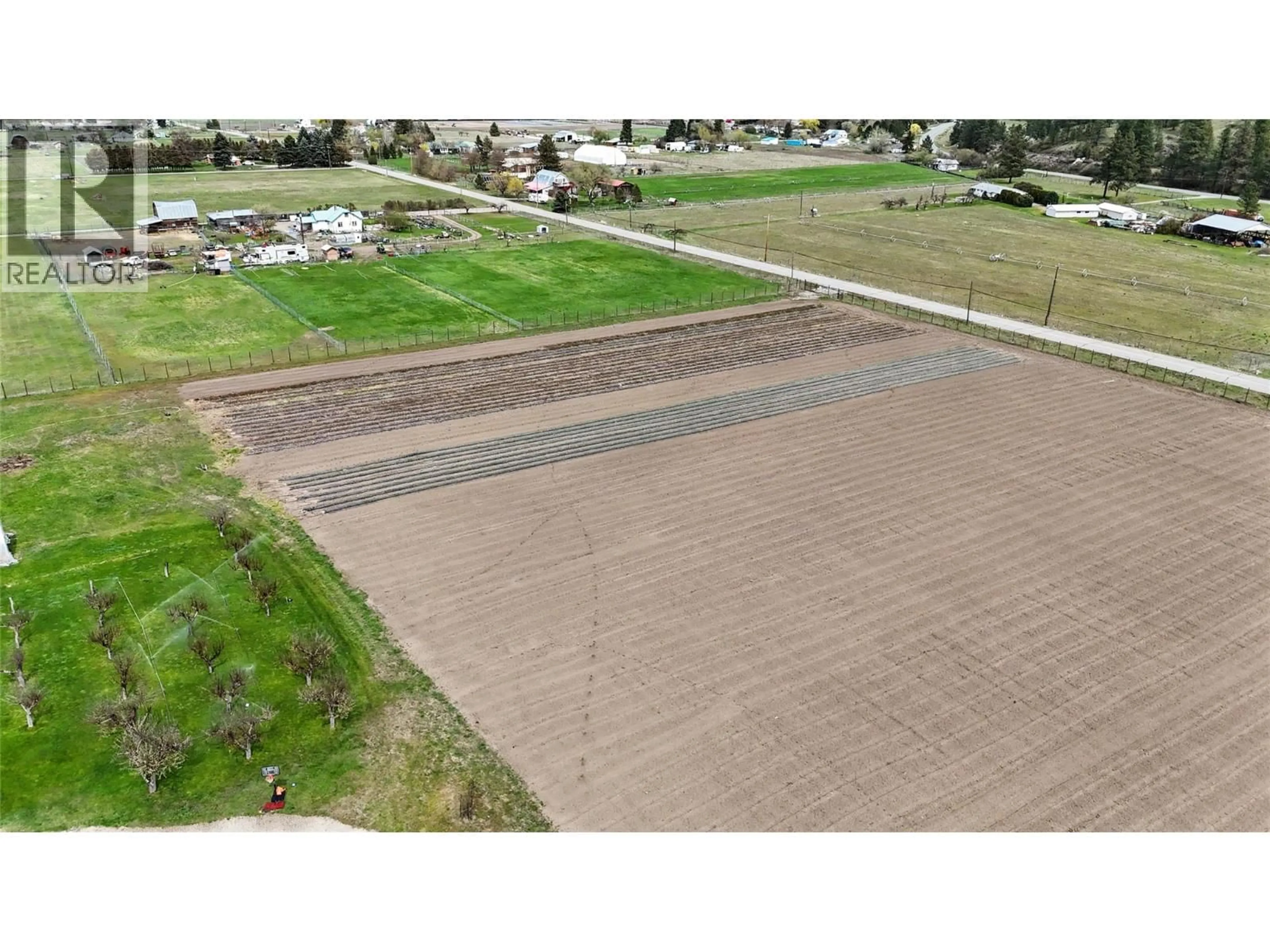 A pic from outside/outdoor area/front of a property/back of a property/a pic from drone, street for 3845 CARSON ROAD, Grand Forks British Columbia V0H1H4