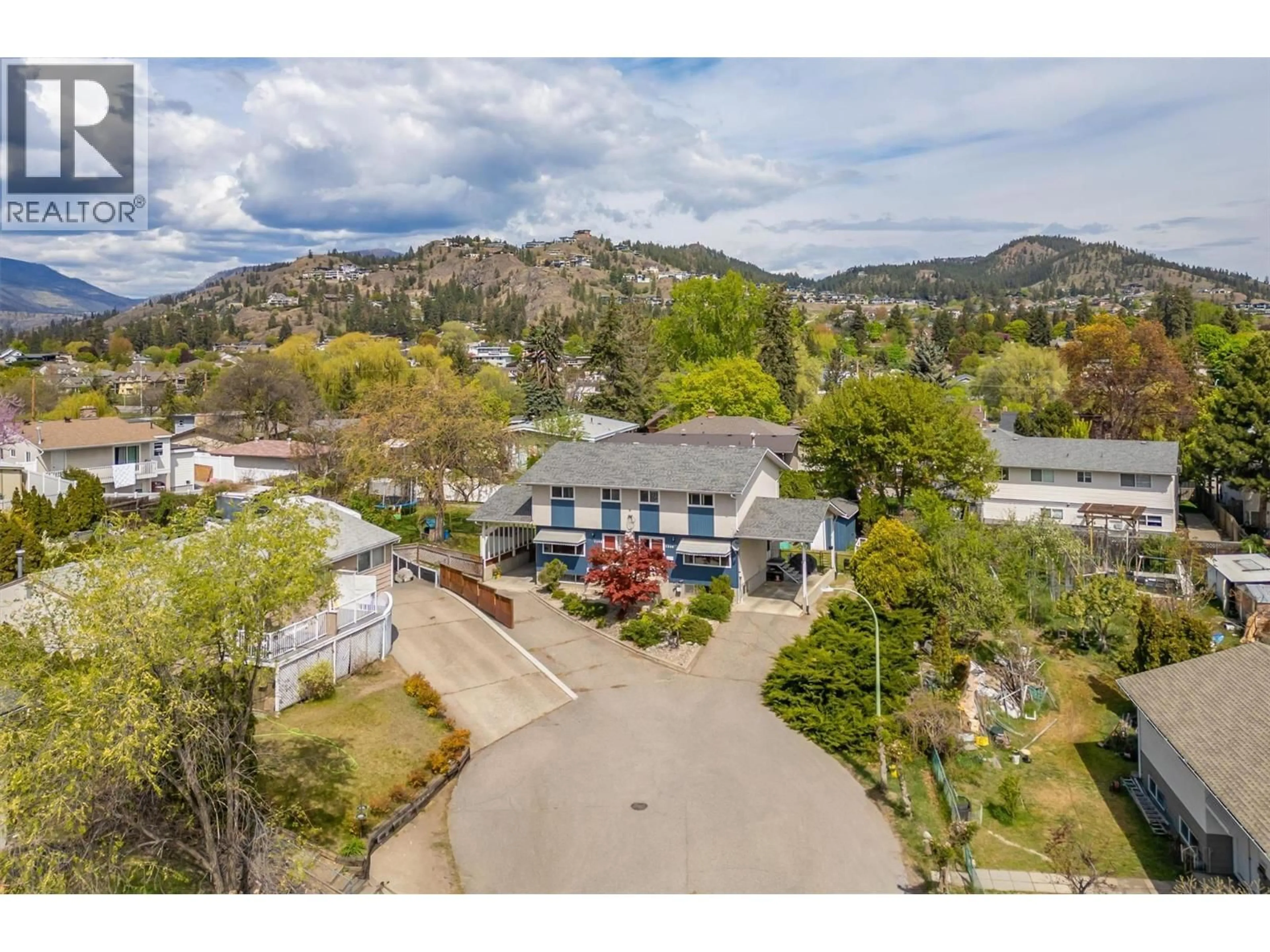 A pic from outside/outdoor area/front of a property/back of a property/a pic from drone, mountain view for 1360 ELM STREET, Kelowna British Columbia V1Y3W6