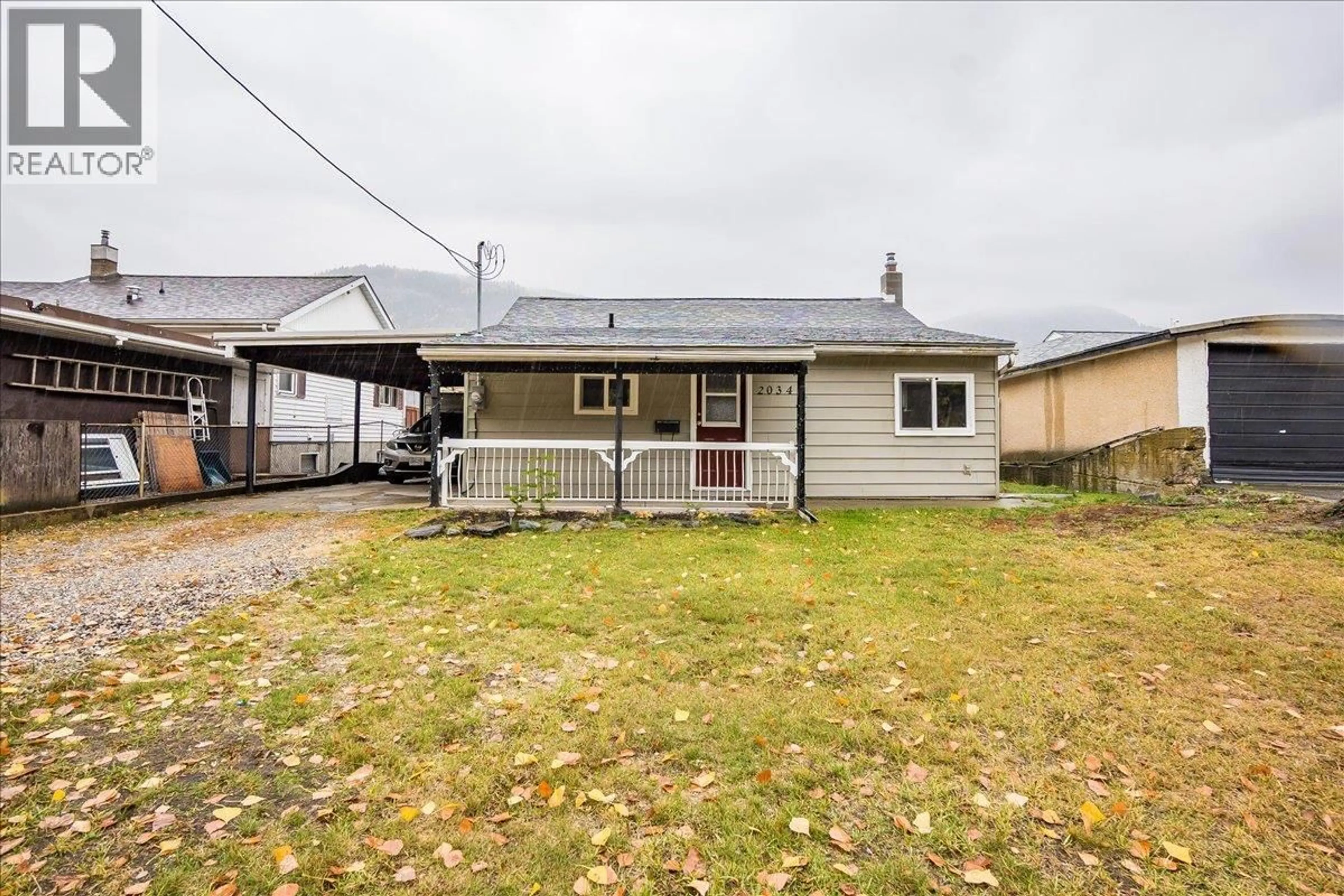 A pic from outside/outdoor area/front of a property/back of a property/a pic from drone, street for 2034 EIGHTH AVENUE, Trail British Columbia V1R3E1