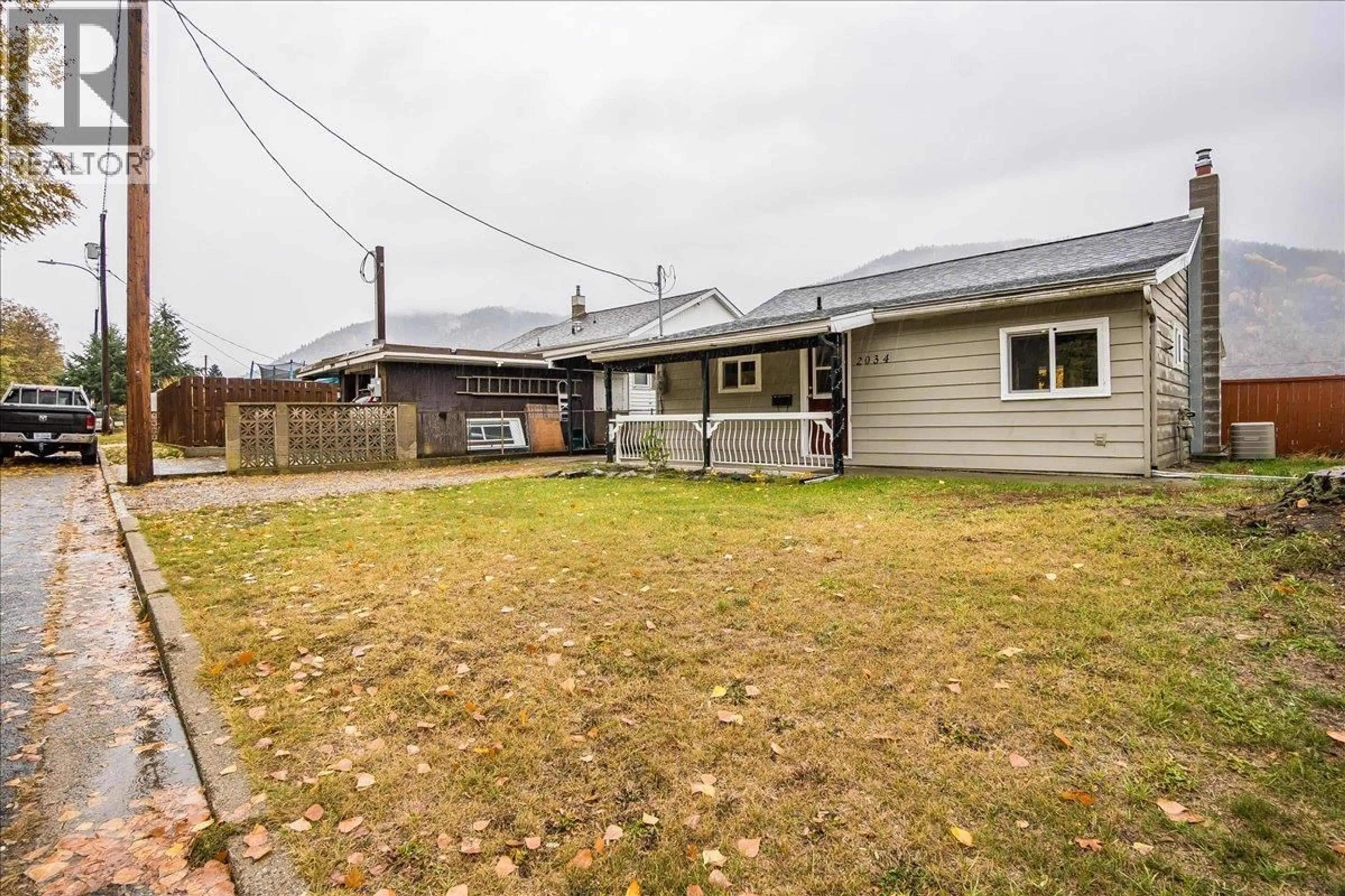 A pic from outside/outdoor area/front of a property/back of a property/a pic from drone, street for 2034 EIGHTH AVENUE, Trail British Columbia V1R3E1