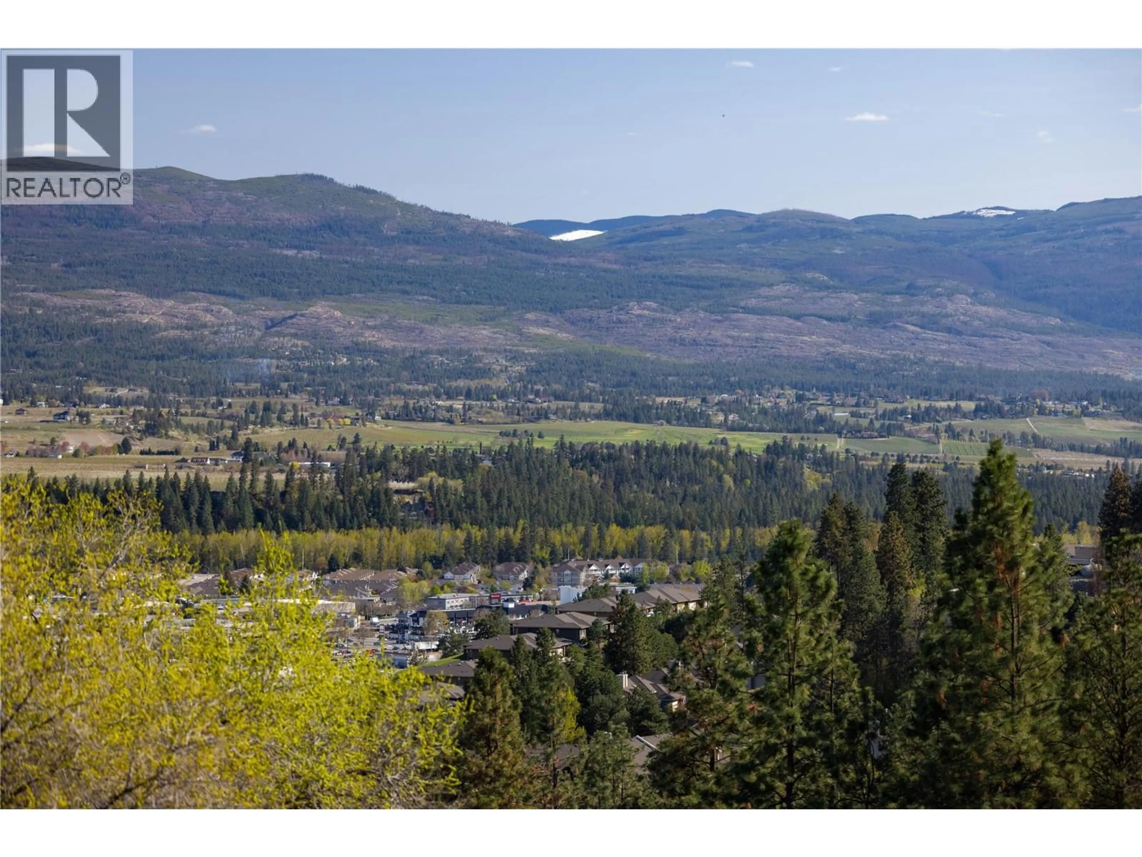 A pic from outside/outdoor area/front of a property/back of a property/a pic from drone, mountain view for 2391 NAHANNI COURT, Kelowna British Columbia V1V1N1
