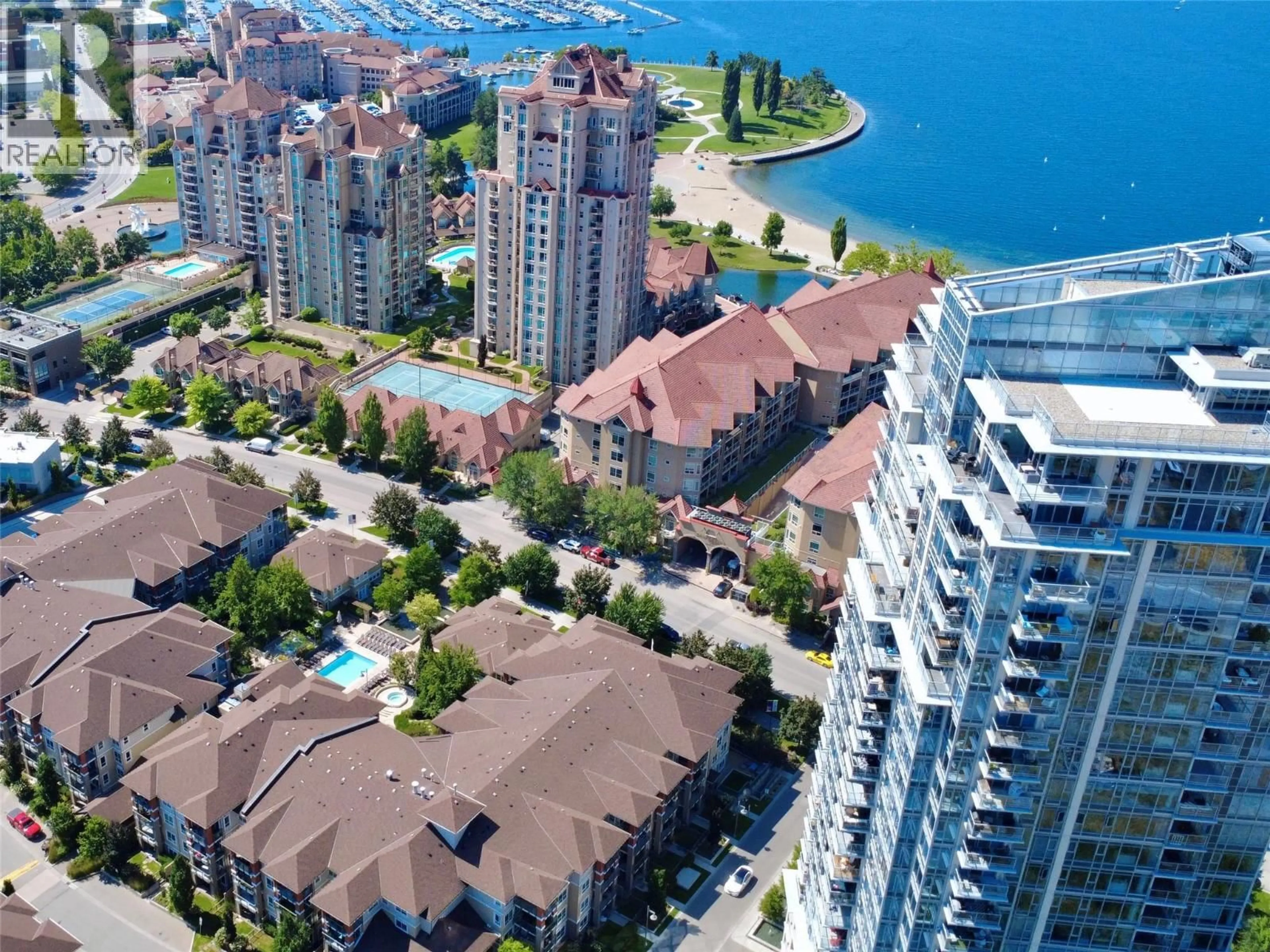 A pic from outside/outdoor area/front of a property/back of a property/a pic from drone, water/lake/river/ocean view for 906 - 1075 SUNSET DRIVE, Kelowna British Columbia V1Y9Y9