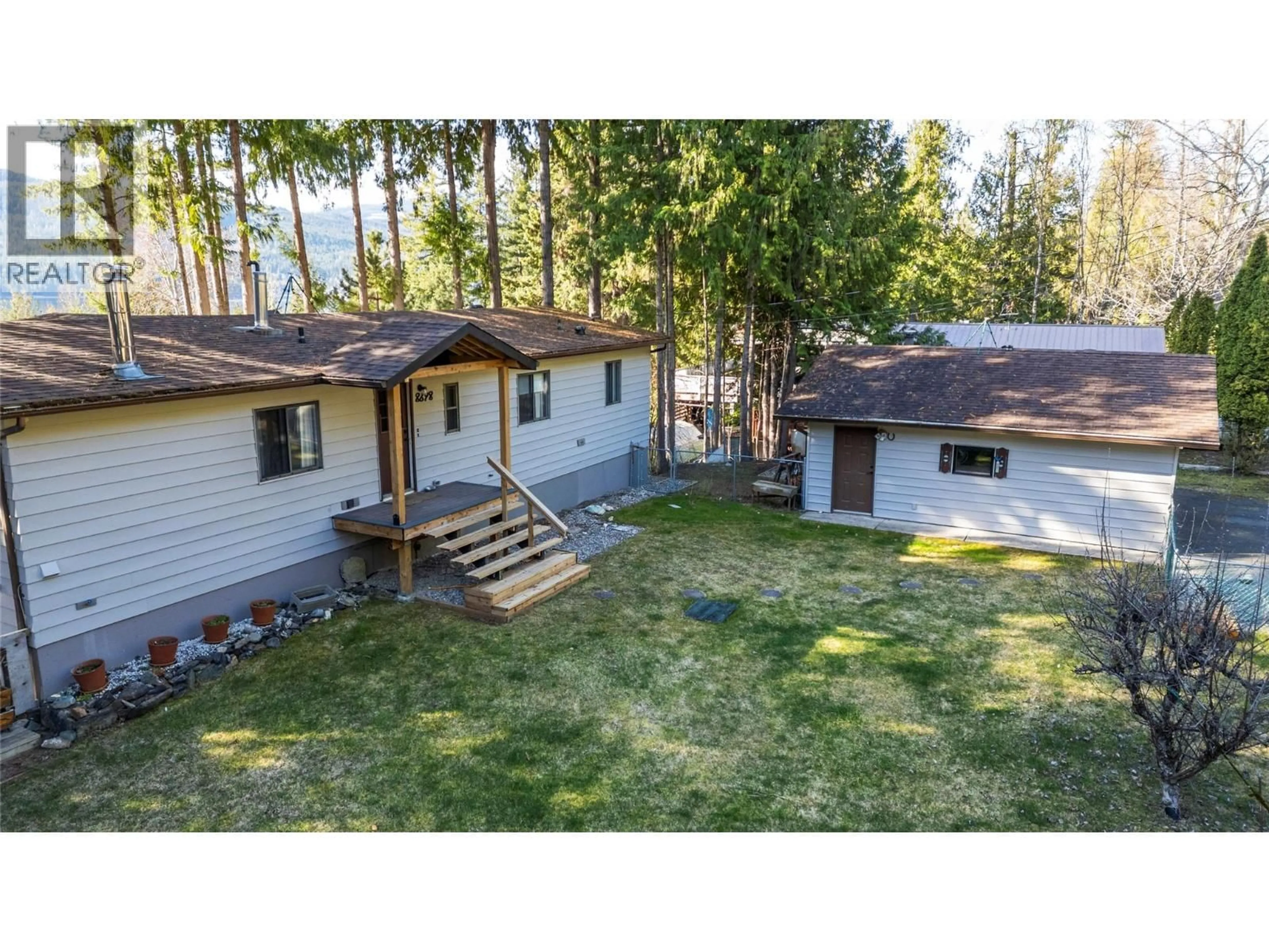 A pic from outside/outdoor area/front of a property/back of a property/a pic from drone, forest/trees view for 8698 PENWITH WAY, St. Ives British Columbia V0E1M9