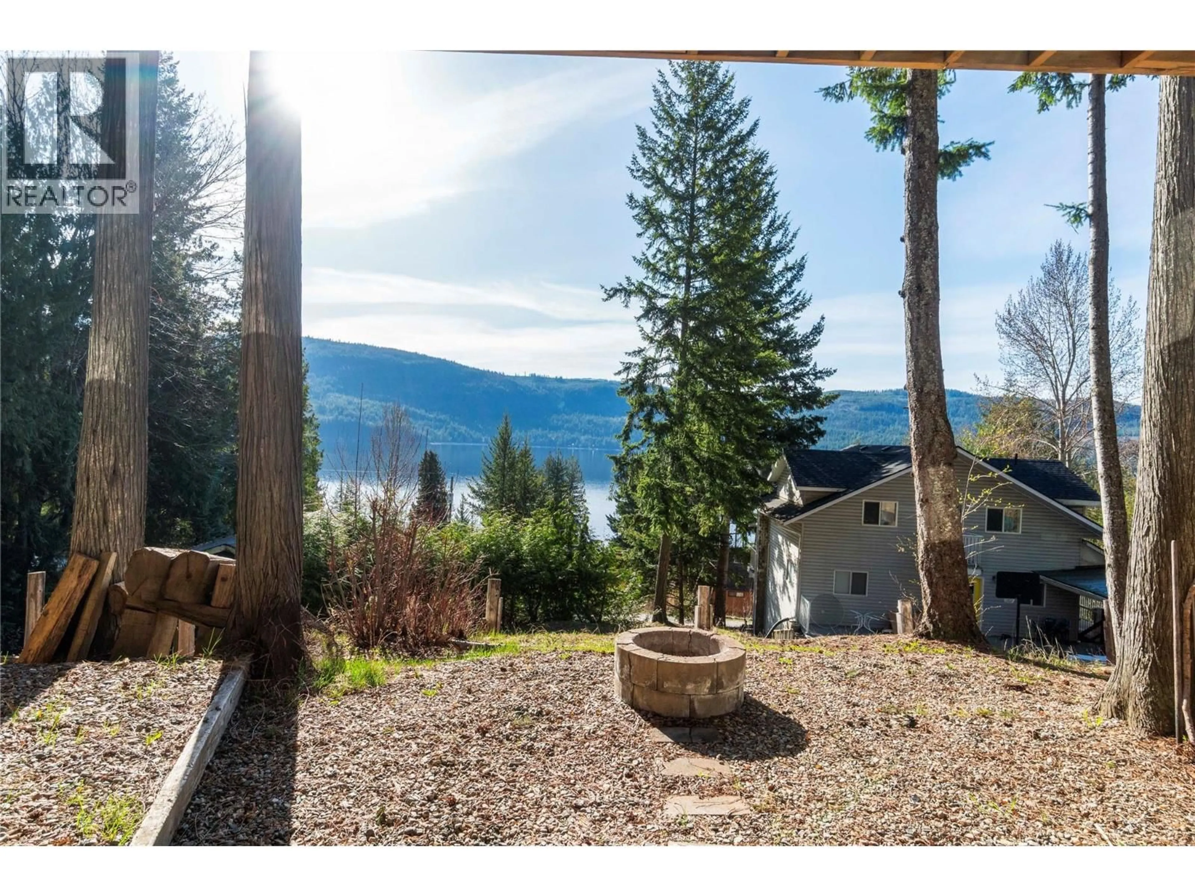A pic from outside/outdoor area/front of a property/back of a property/a pic from drone, mountain view for 8698 PENWITH WAY, St. Ives British Columbia V0E1M9