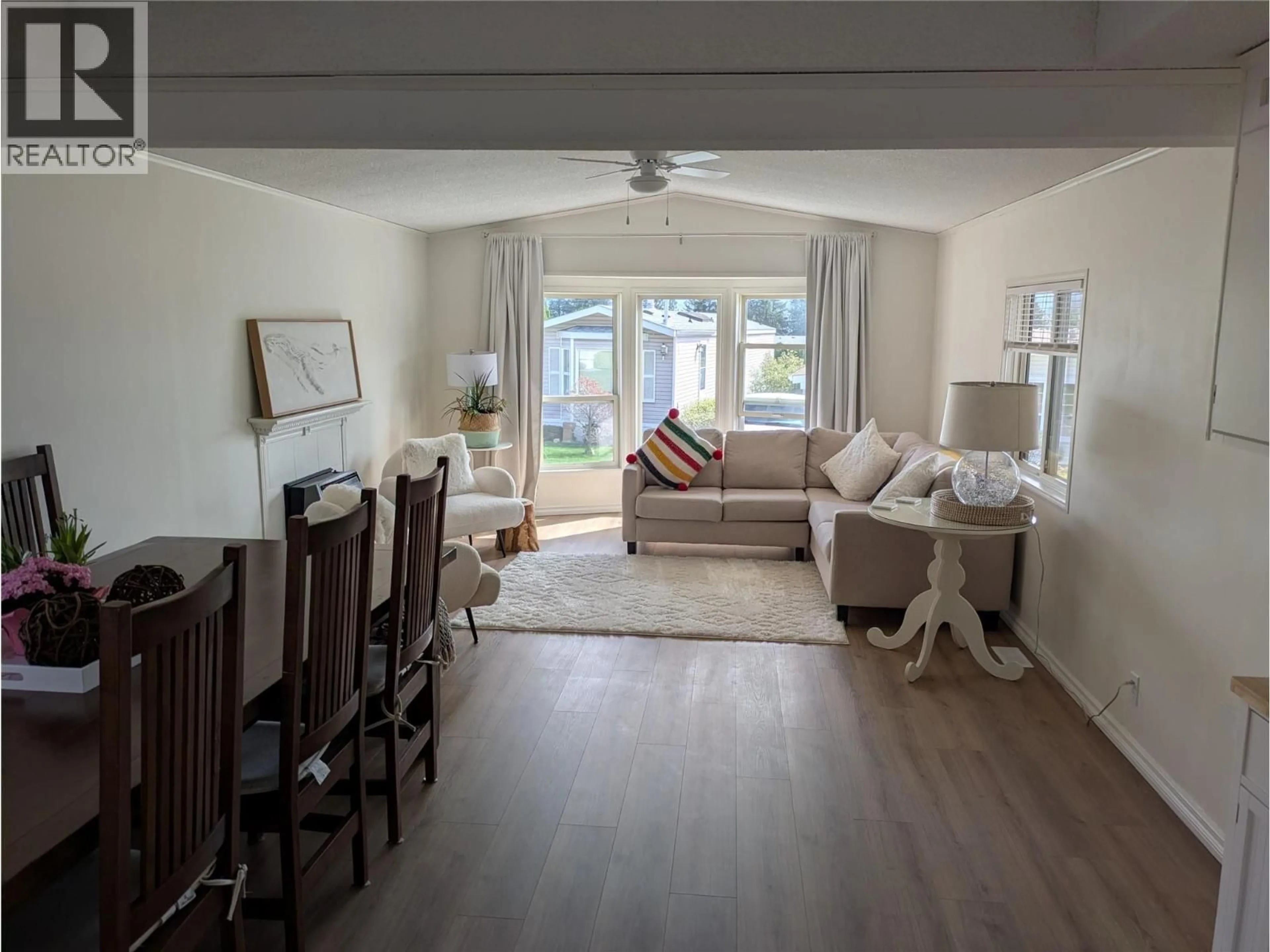 Living room with furniture, wood/laminate floor for 54 - 1850 SHANNON LAKE ROAD, West Kelowna British Columbia V4T1L6