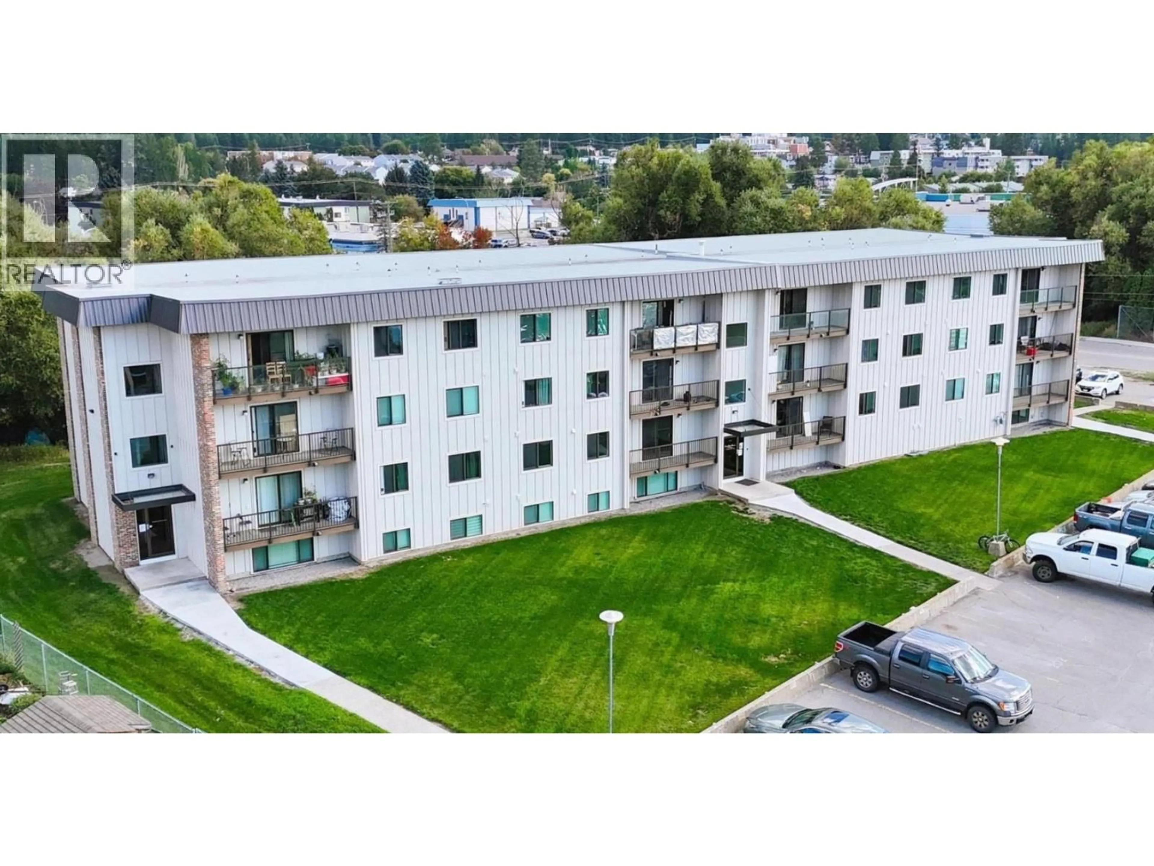 A pic from outside/outdoor area/front of a property/back of a property/a pic from drone, building for 407 - 606 18TH AVENUE NORTH, Cranbrook British Columbia V1C5M1