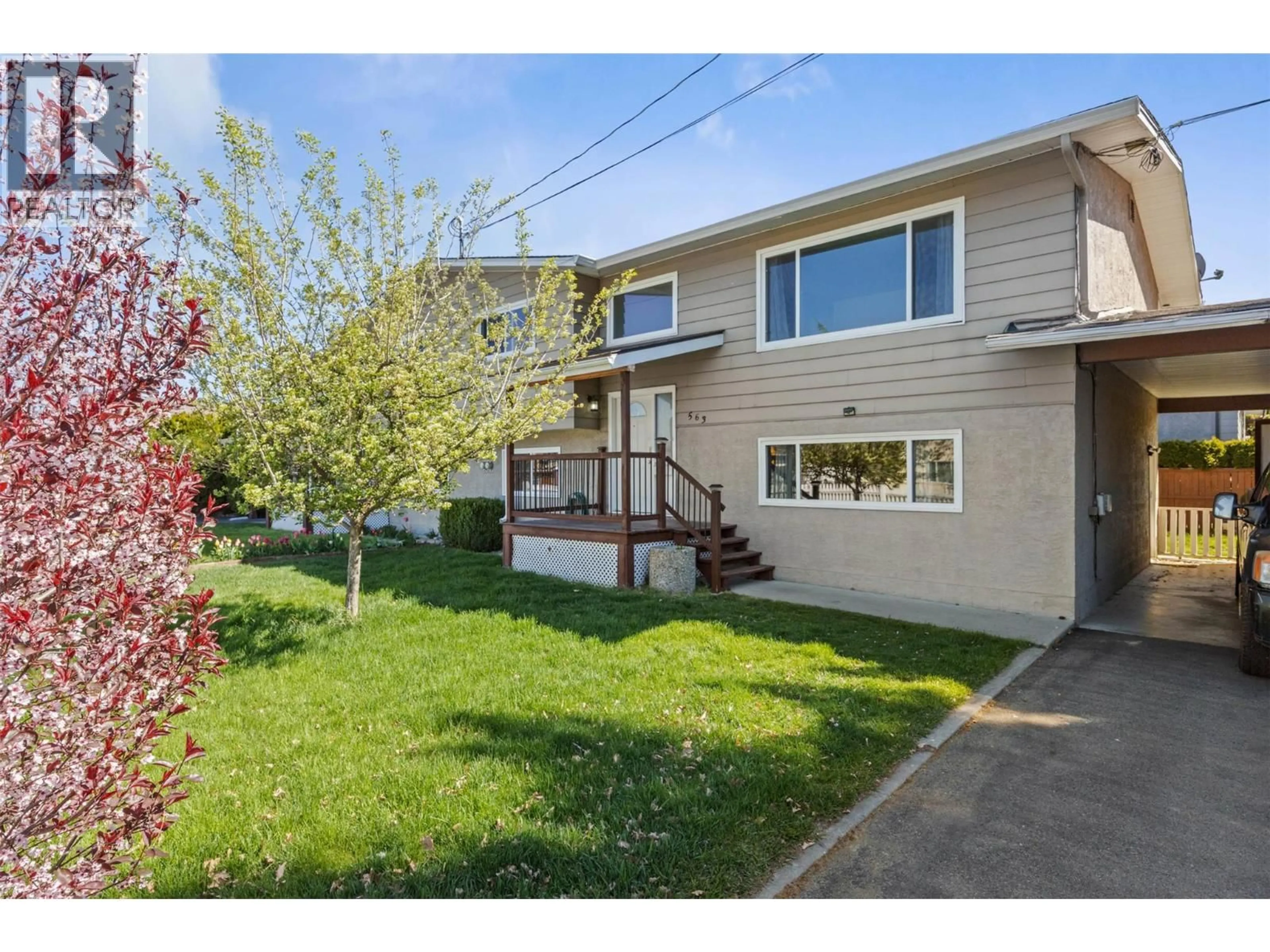 Home with vinyl exterior material, street for 563 HEMLOCK ROAD, Kelowna British Columbia V1X4W8