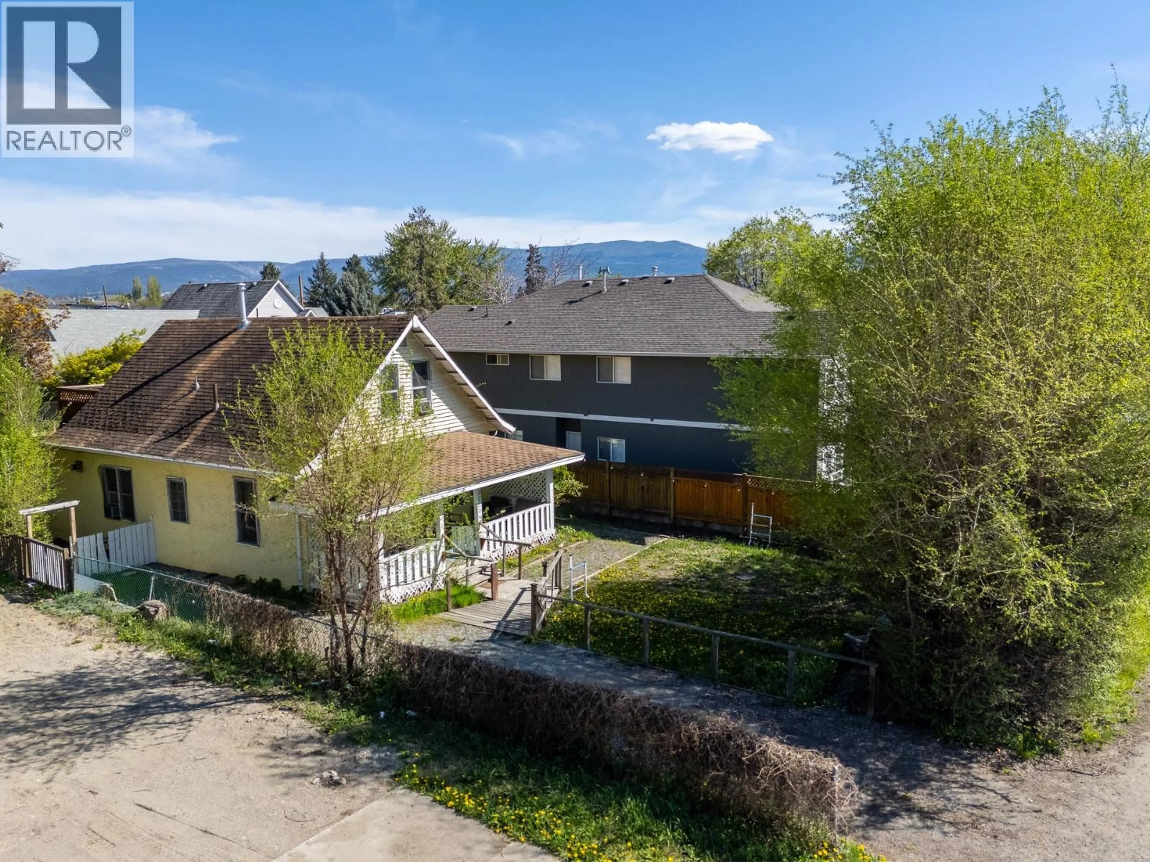 A pic from outside/outdoor area/front of a property/back of a property/a pic from drone, mountain view for 2029 RICHTER STREET, Kelowna British Columbia V1Y2N4