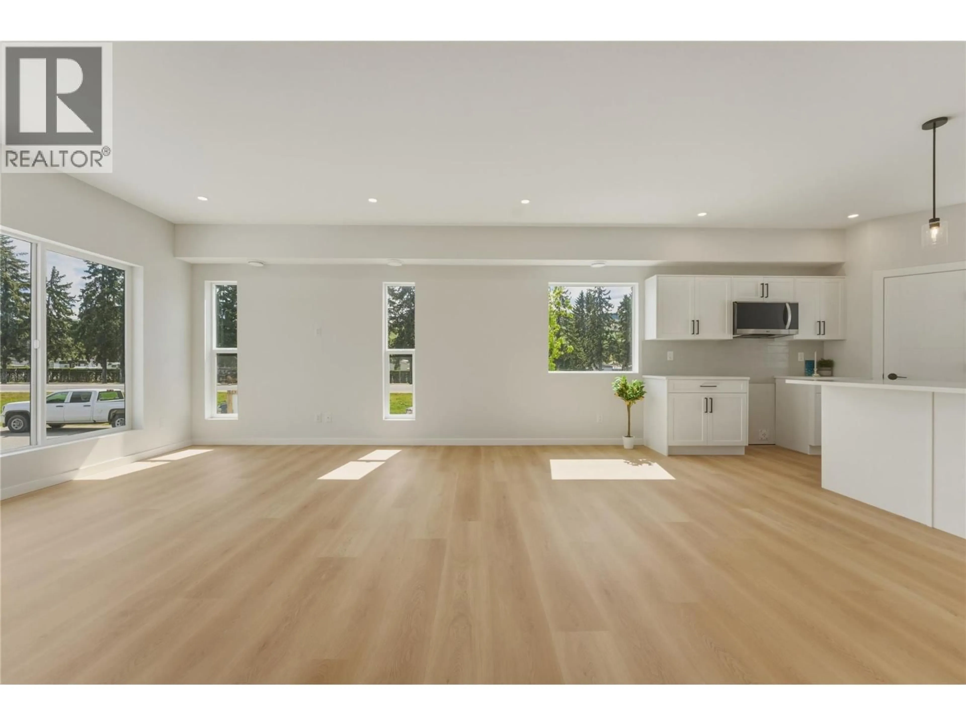 Open concept kitchen, wood/laminate floor for 1 - 5661 OKANAGAN LANDING ROAD, Vernon British Columbia V1T7A6