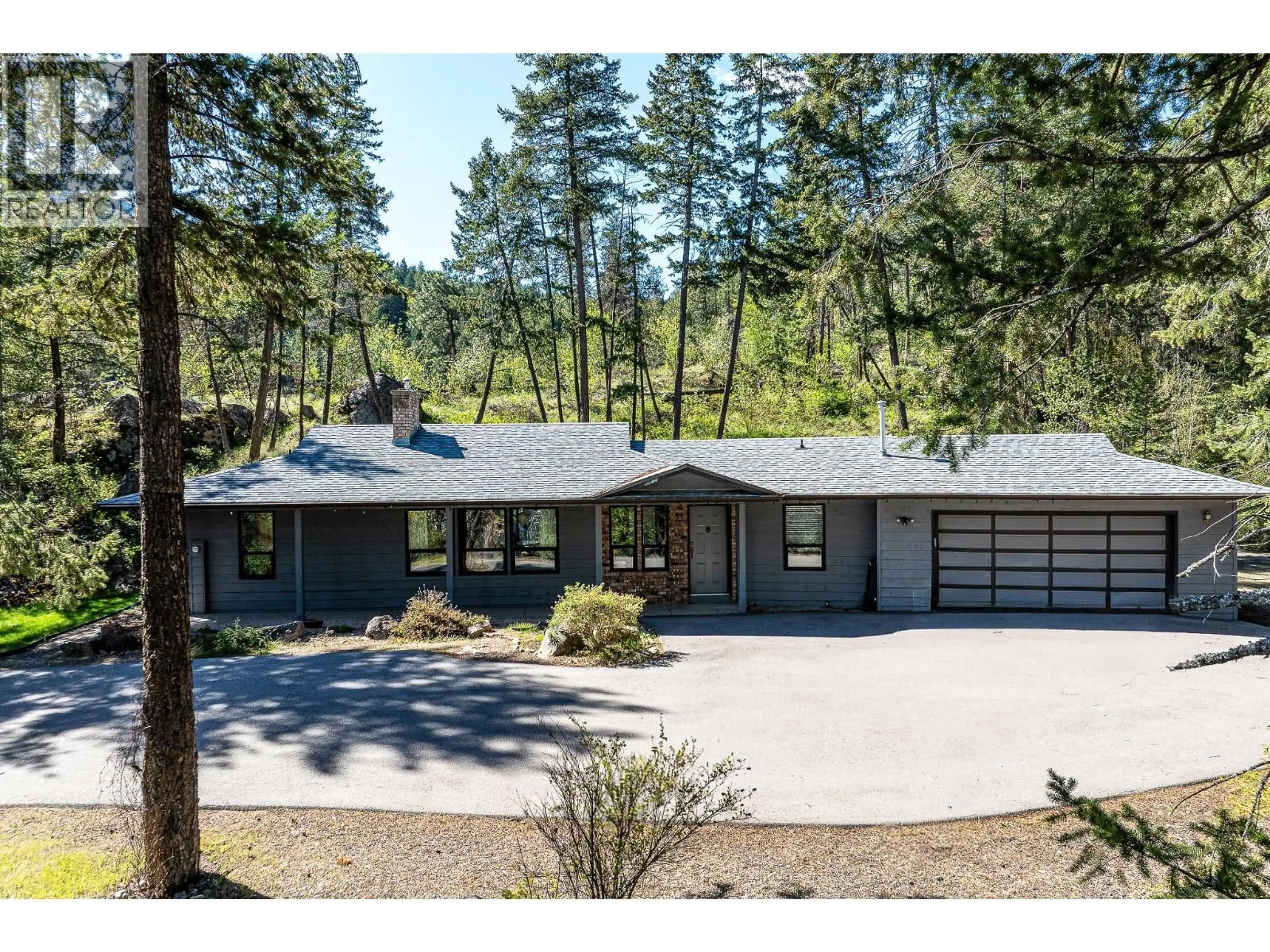 A pic from outside/outdoor area/front of a property/back of a property/a pic from drone, forest/trees view for 9276 CHINOOK ROAD, Vernon British Columbia V1H1K3