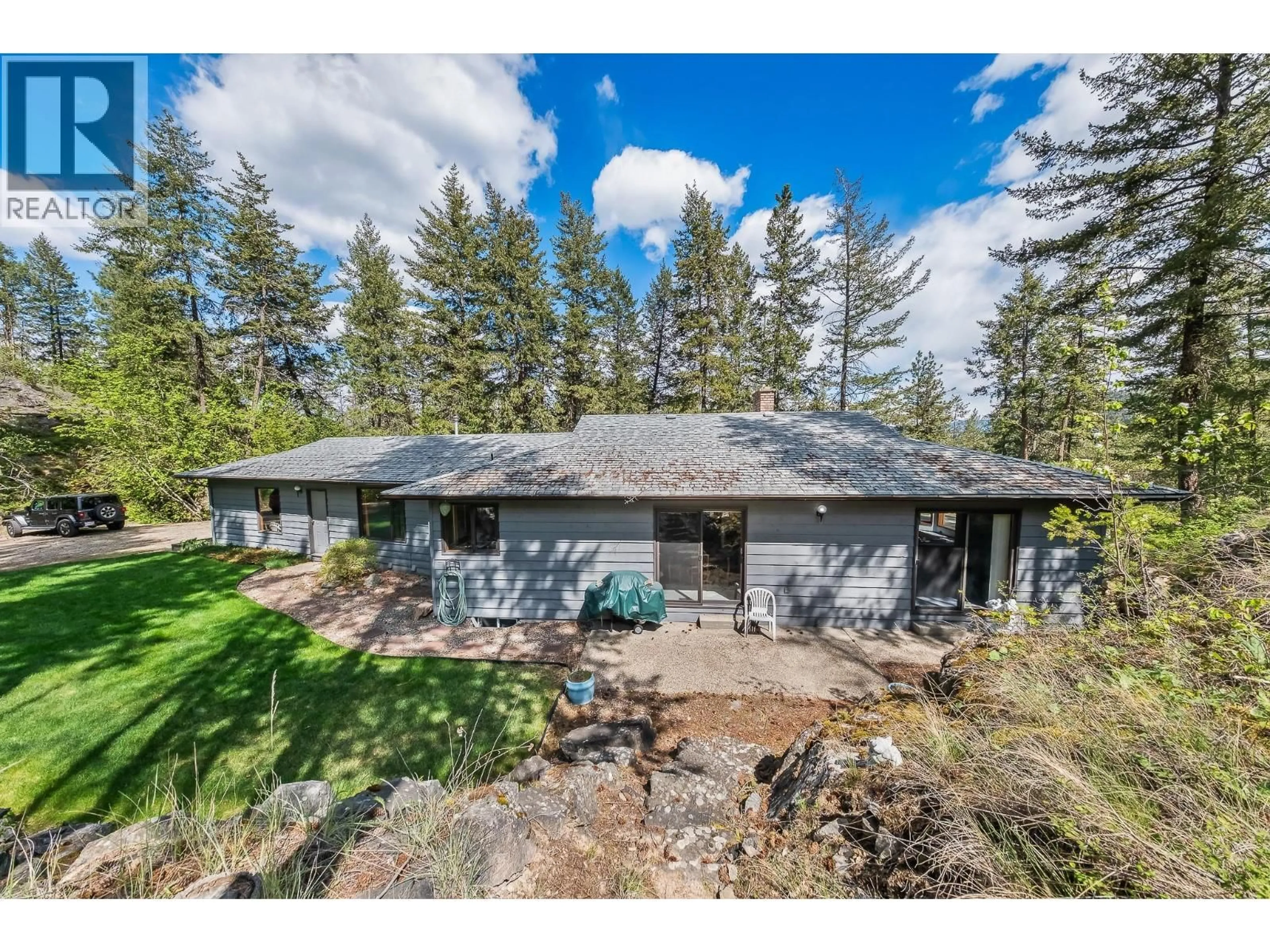 A pic from outside/outdoor area/front of a property/back of a property/a pic from drone, unknown for 9276 CHINOOK ROAD, Vernon British Columbia V1H1K3