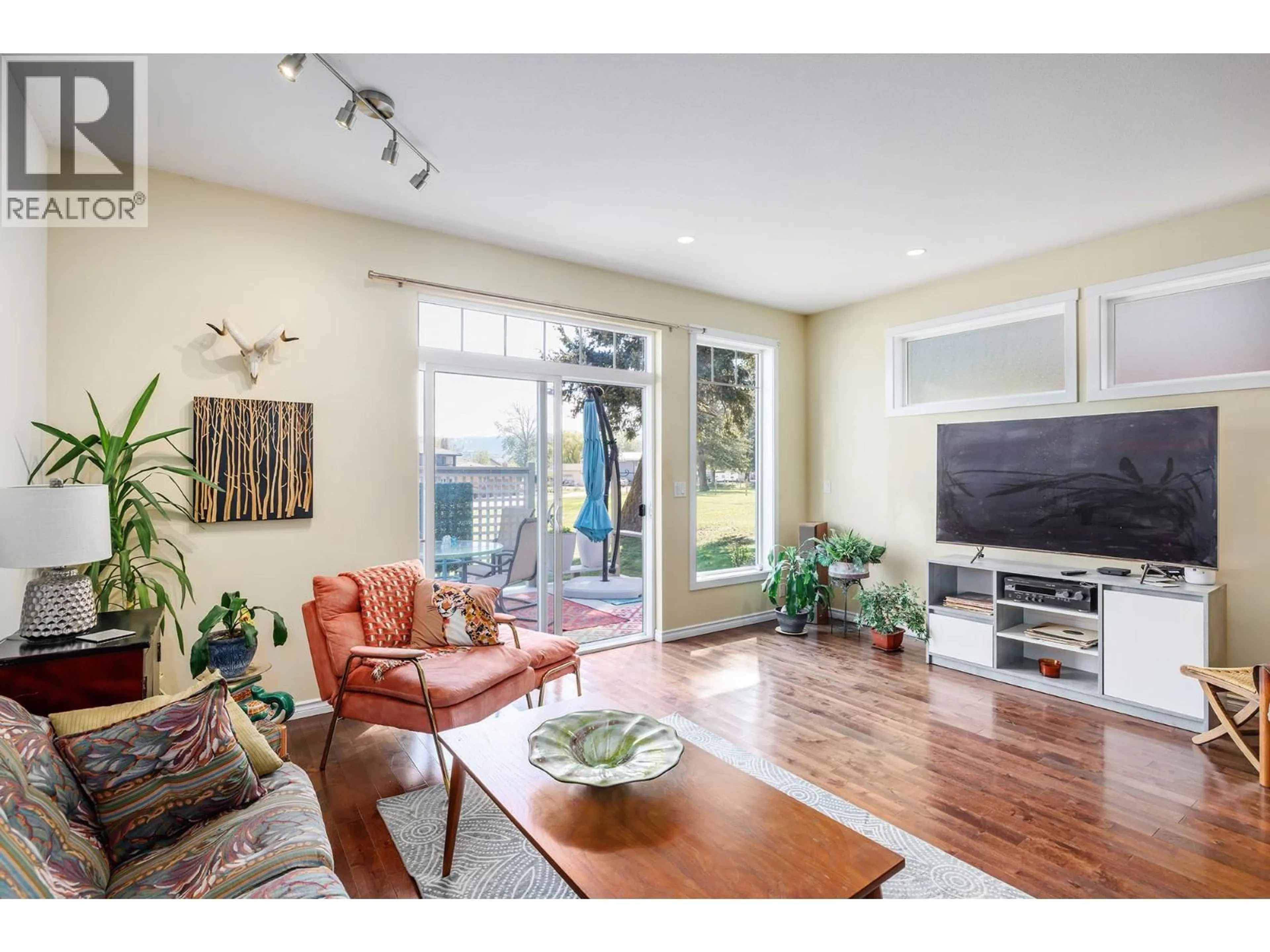 Living room with furniture, wood/laminate floor for 120 DEER STREET, Vernon British Columbia V1H2A1