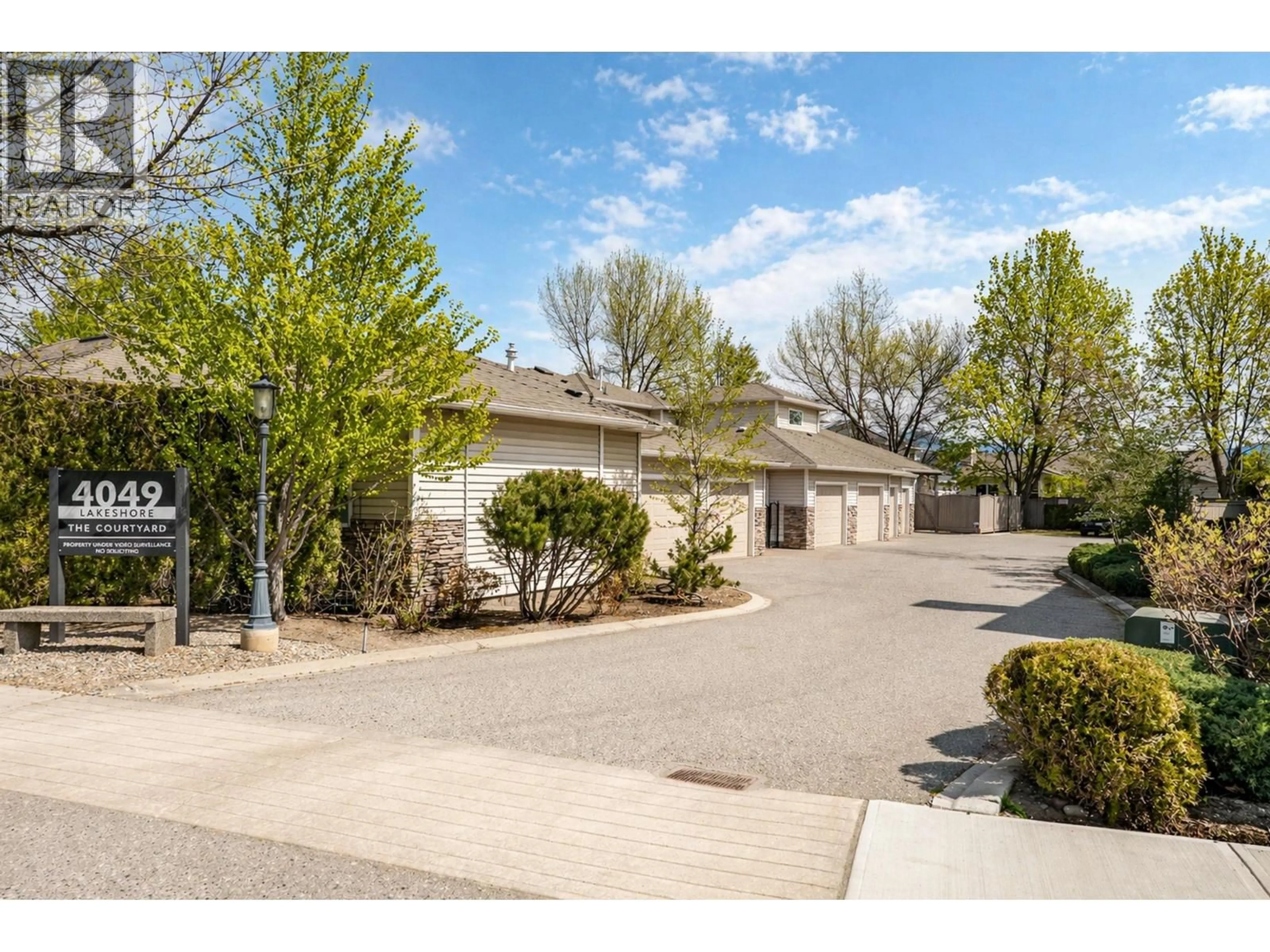 A pic from outside/outdoor area/front of a property/back of a property/a pic from drone, street for 105 - 4049 LAKESHORE DRIVE, Kelowna British Columbia V1W1V7