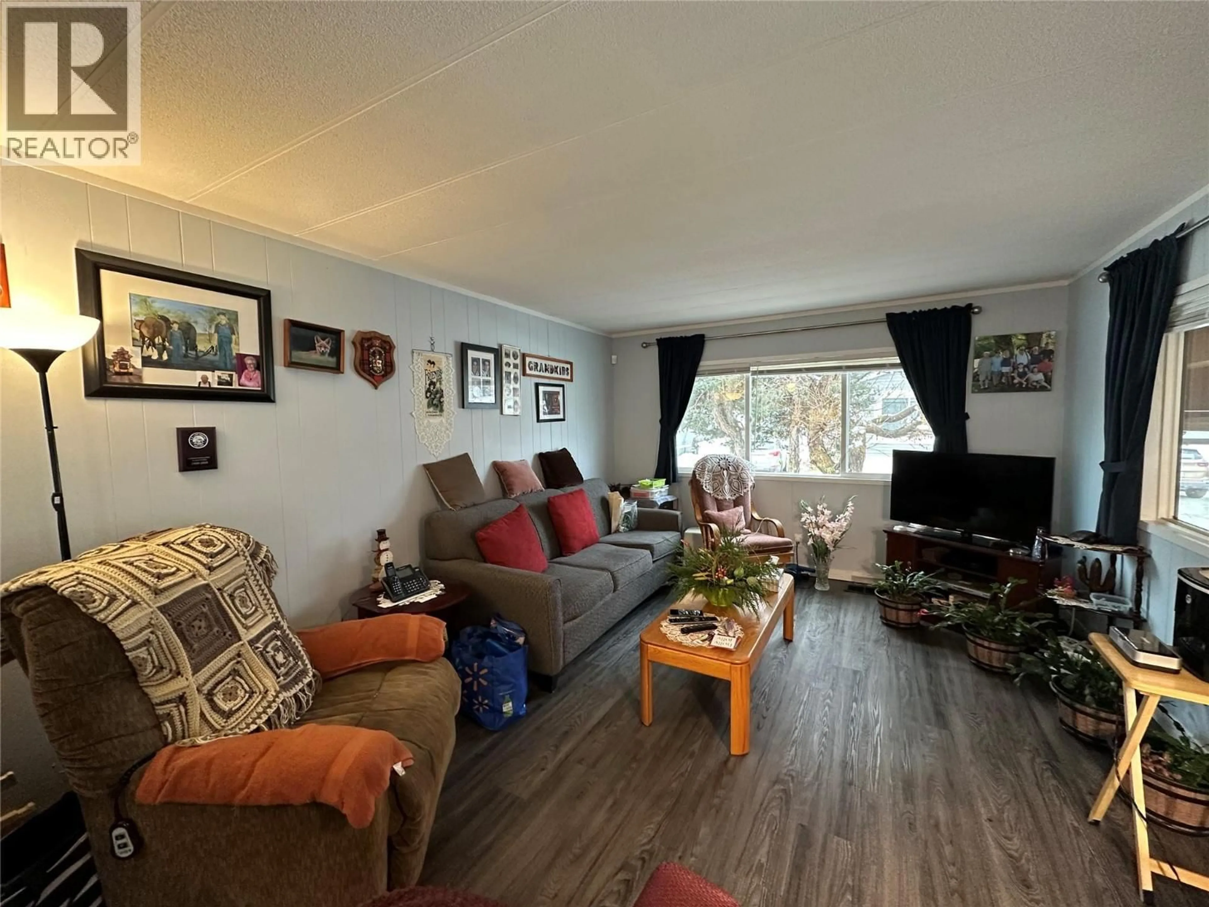 Living room with furniture, wood/laminate floor for 15 - 473 CORINA AVENUE, Princeton British Columbia V0X1W0