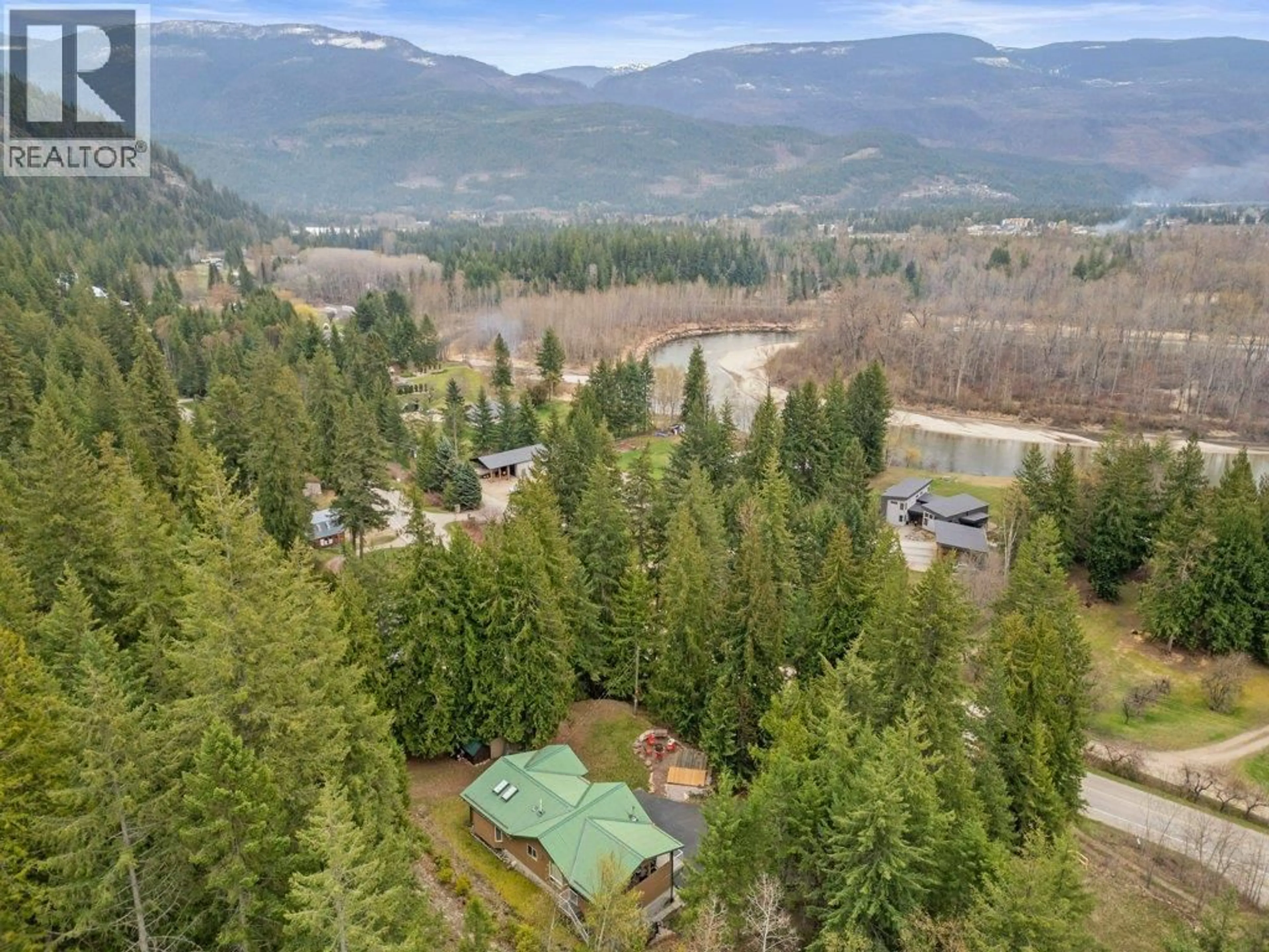A pic from outside/outdoor area/front of a property/back of a property/a pic from drone, mountain view for 12 OLD TOWN ROAD, Sicamous British Columbia V0E2V4