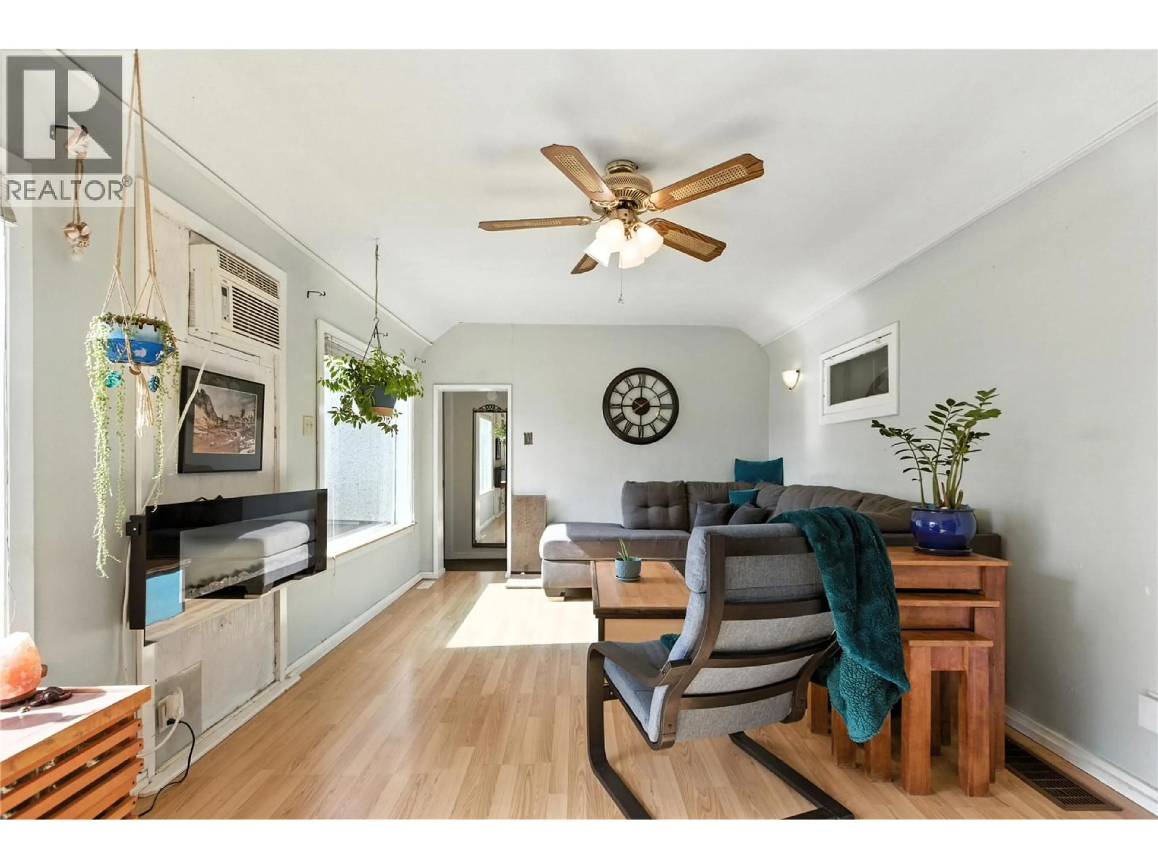 Living room with furniture, wood/laminate floor for 134 KING STREET, Kamloops British Columbia V2B3Z8