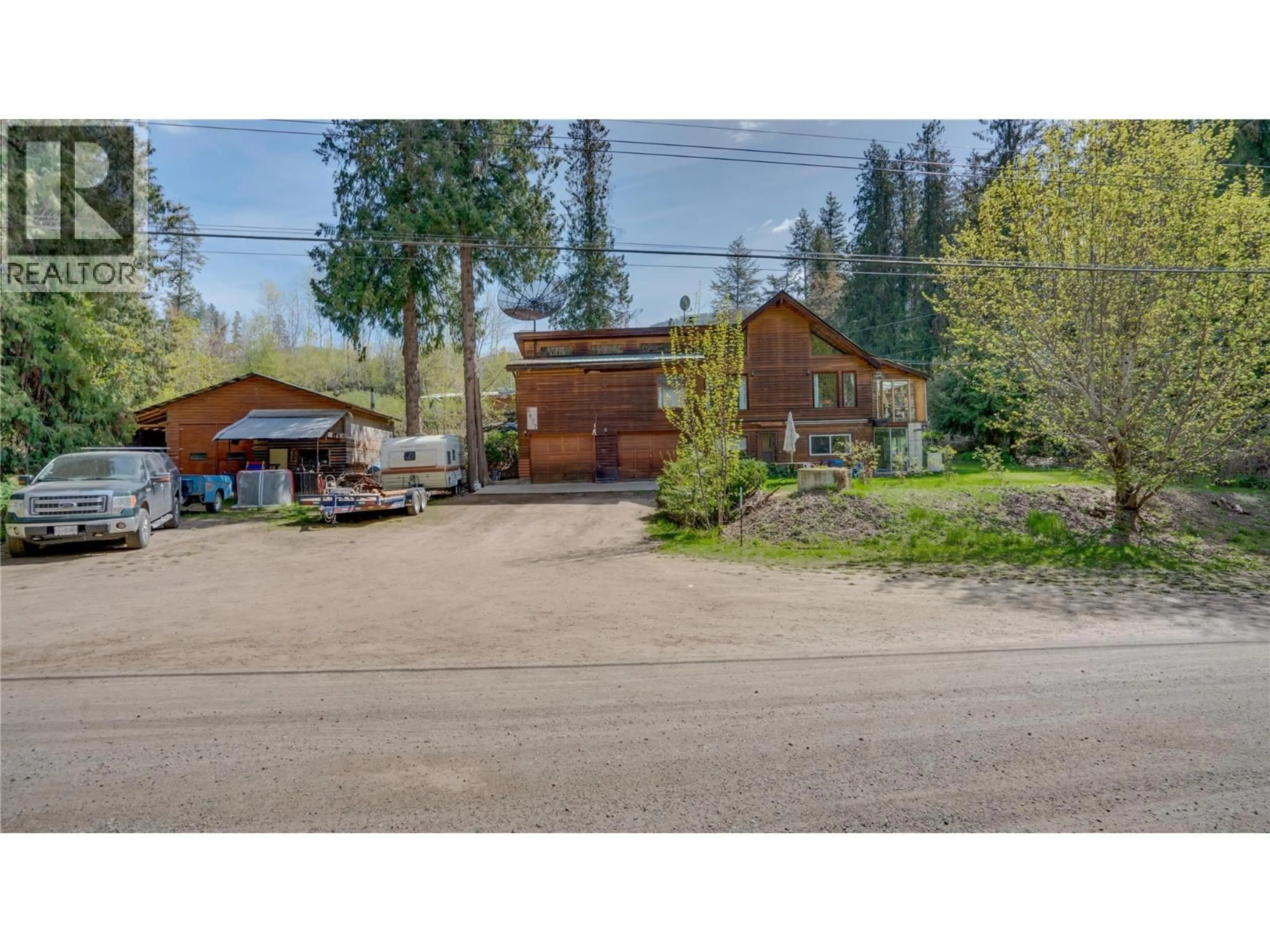 A pic from outside/outdoor area/front of a property/back of a property/a pic from drone, street for 5677 BRENTWOOD ROAD, Vernon British Columbia V1B3K1