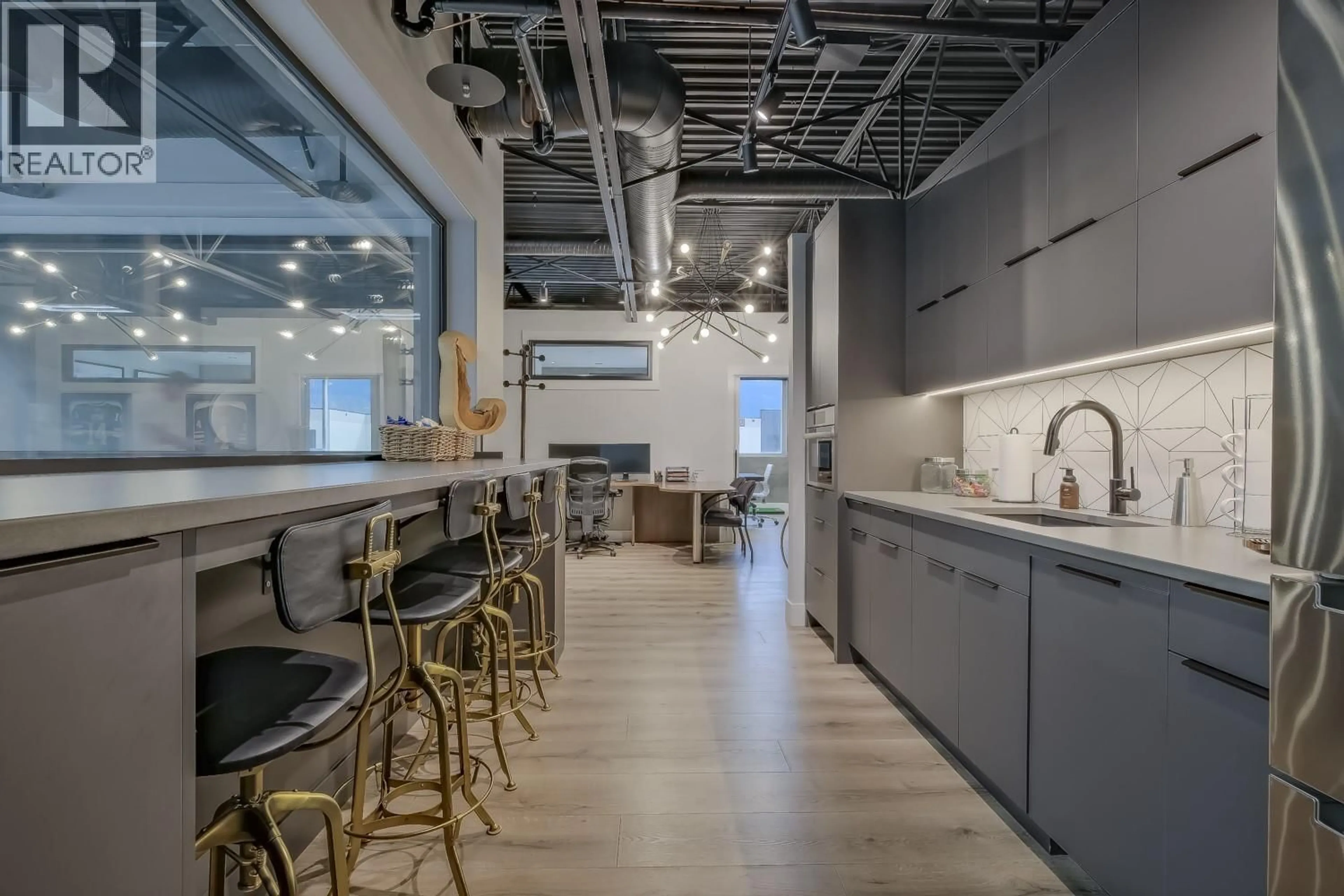 Open concept kitchen, cement floor for 18 - 2110 MATRIX CRESCENT, Kelowna British Columbia V1V0C1