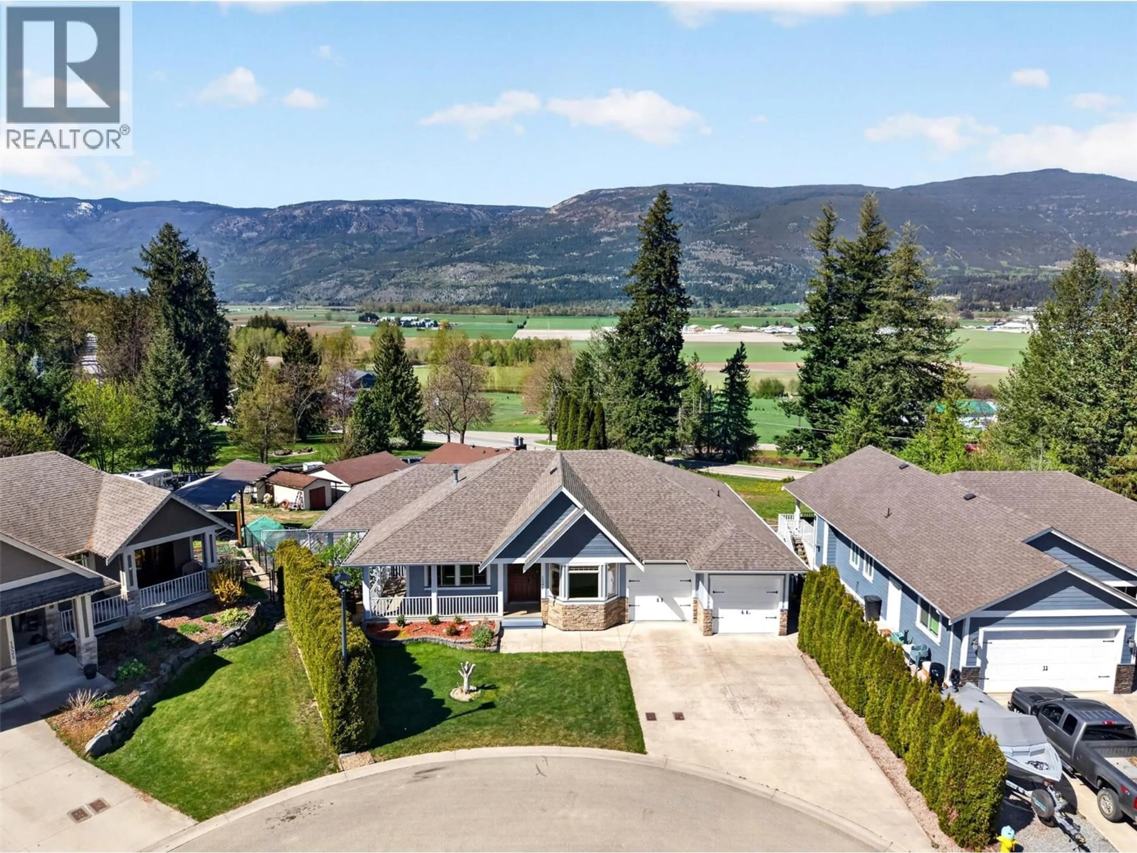 A pic from outside/outdoor area/front of a property/back of a property/a pic from drone, mountain view for 1291 23 AVENUE SOUTHWEST, Salmon Arm British Columbia V1E0A9